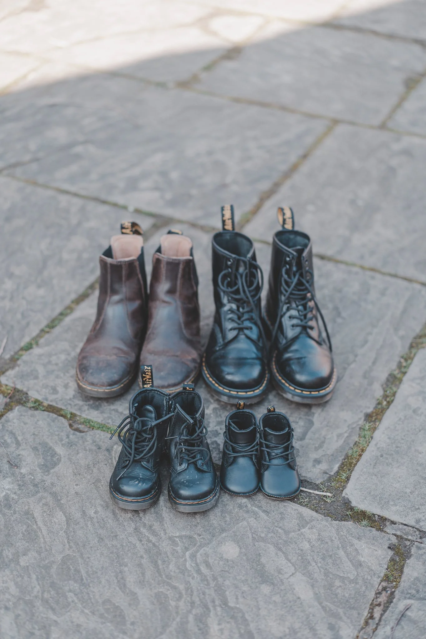 Detail of family members shoes on a family photoshoot at the Coventry Cathedral in Coventry
