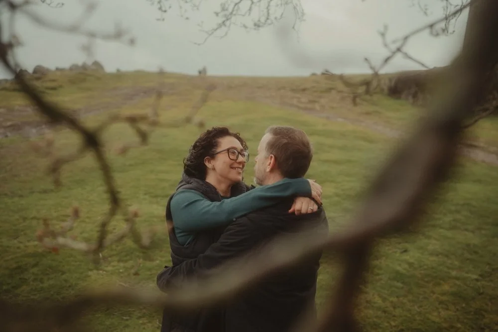 Couple holding each other during a pre-wedding photo session at Bradgate Park, Leicester