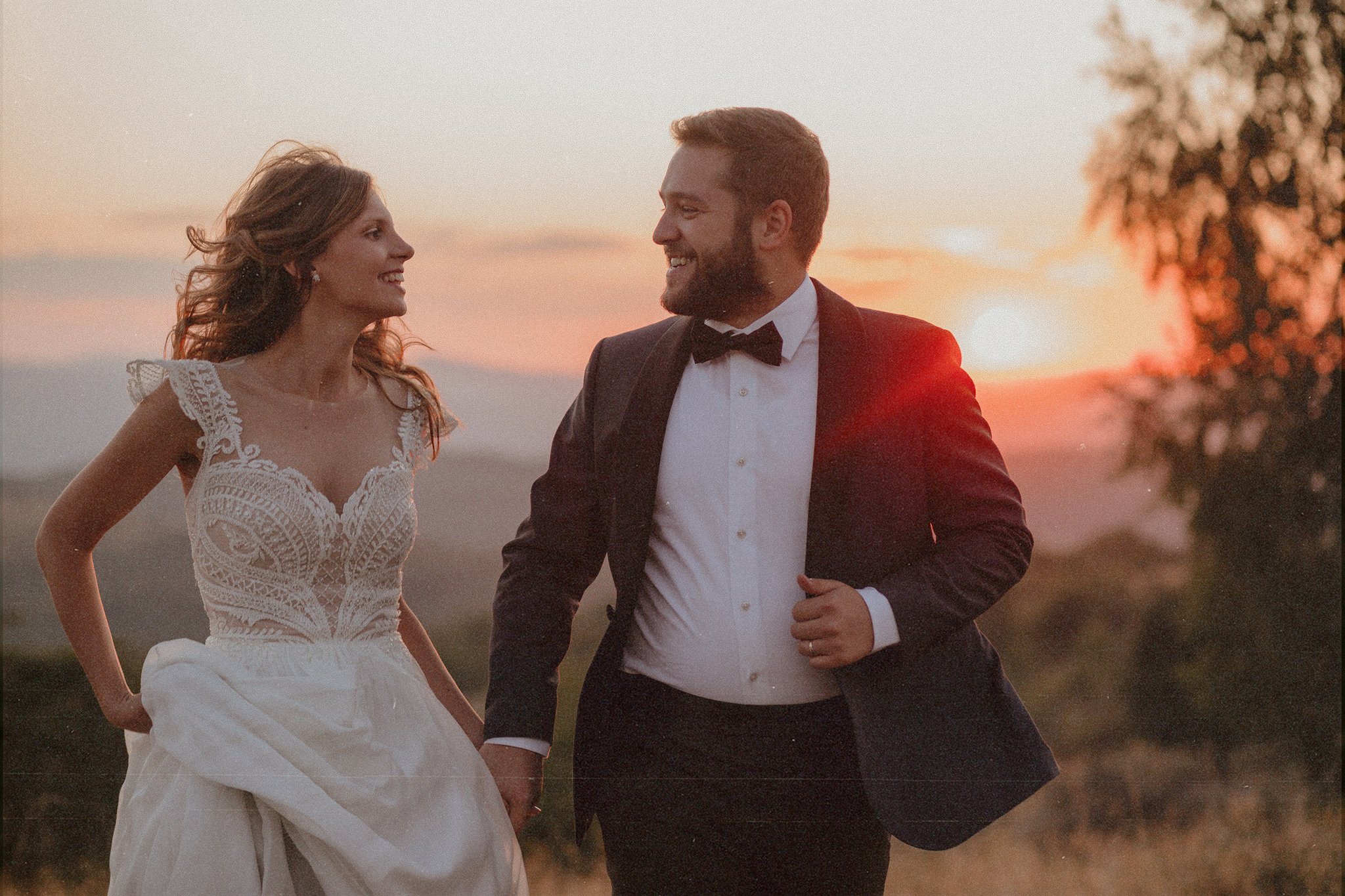 Bride and groom having fun at a trash the dress photoshoot