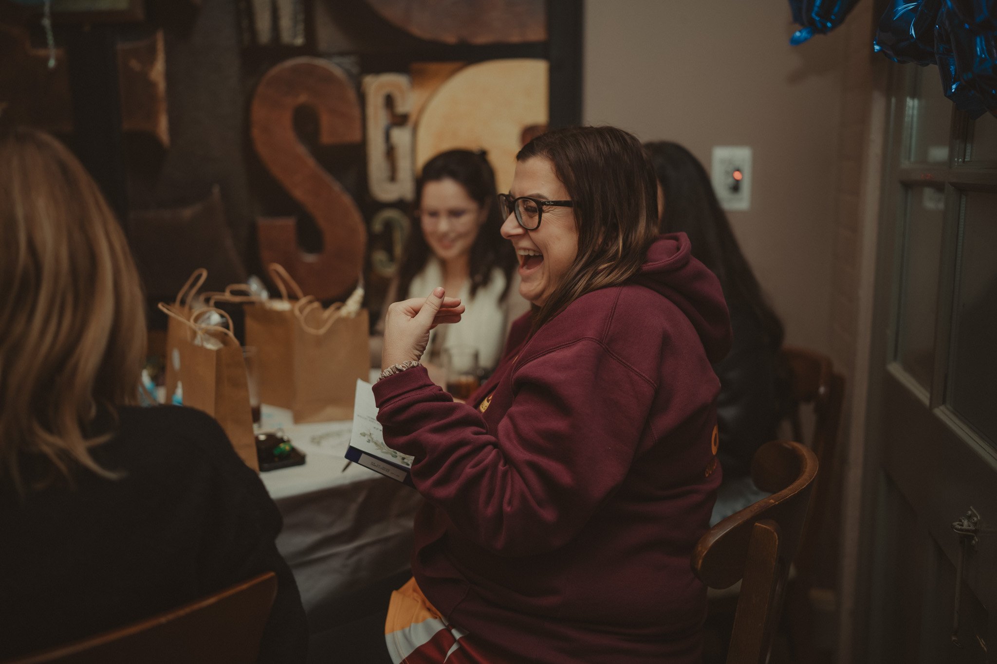 Guests having fun at a baby shower at the Millpool, Coventry