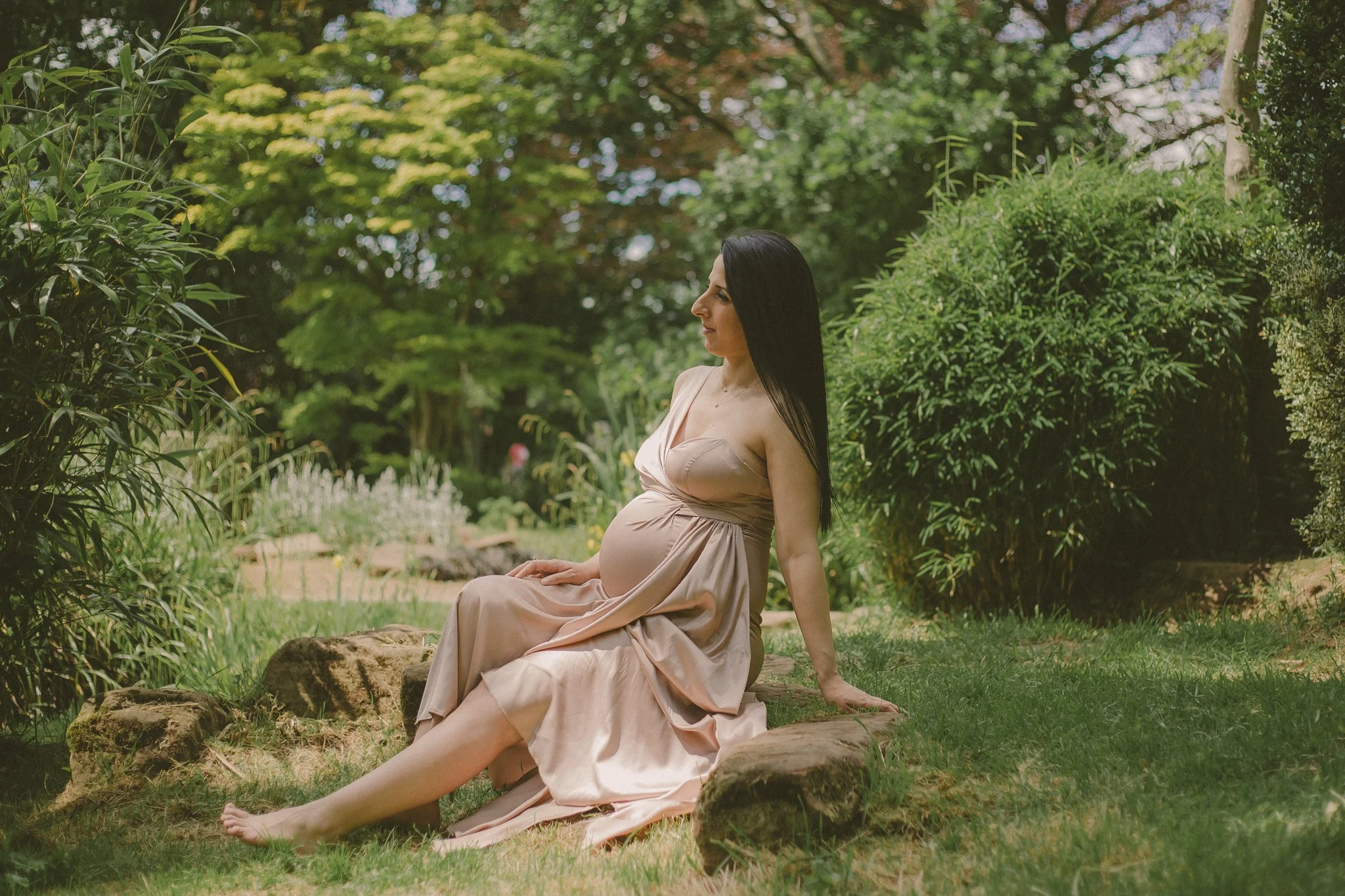 Woman in a dress during a maternity shooting in War Memorial park, Coventry