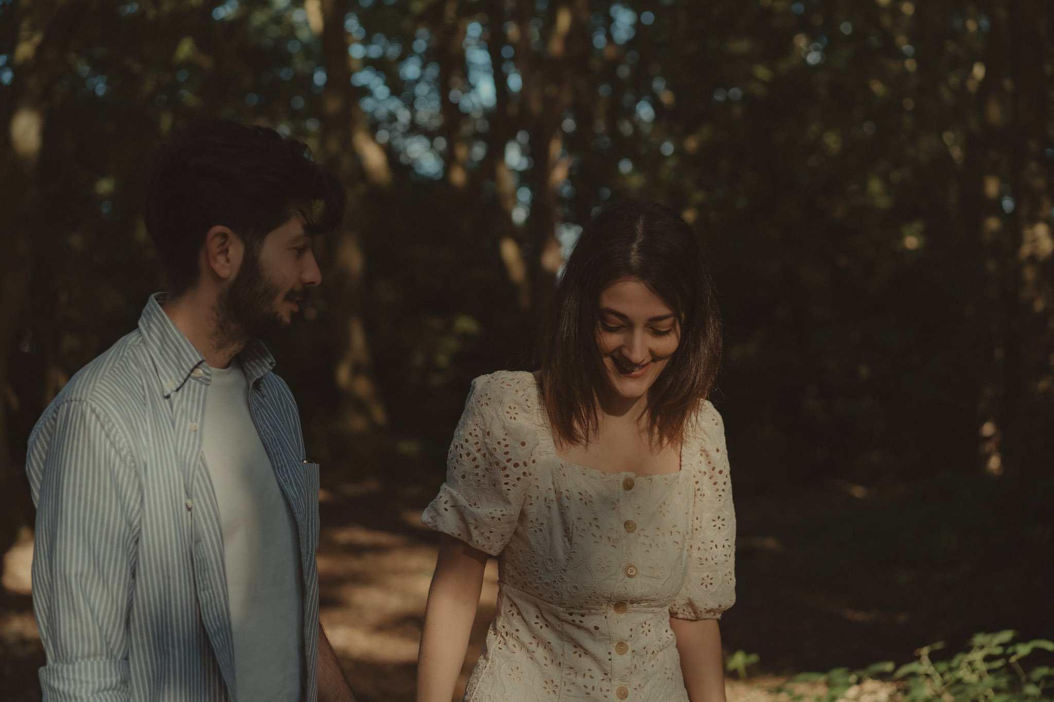 Young couple walking together during their couple photoshoot
