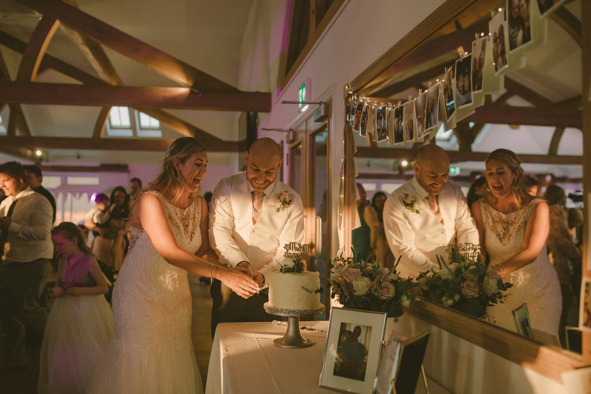 Bride and groom cutting the cake 