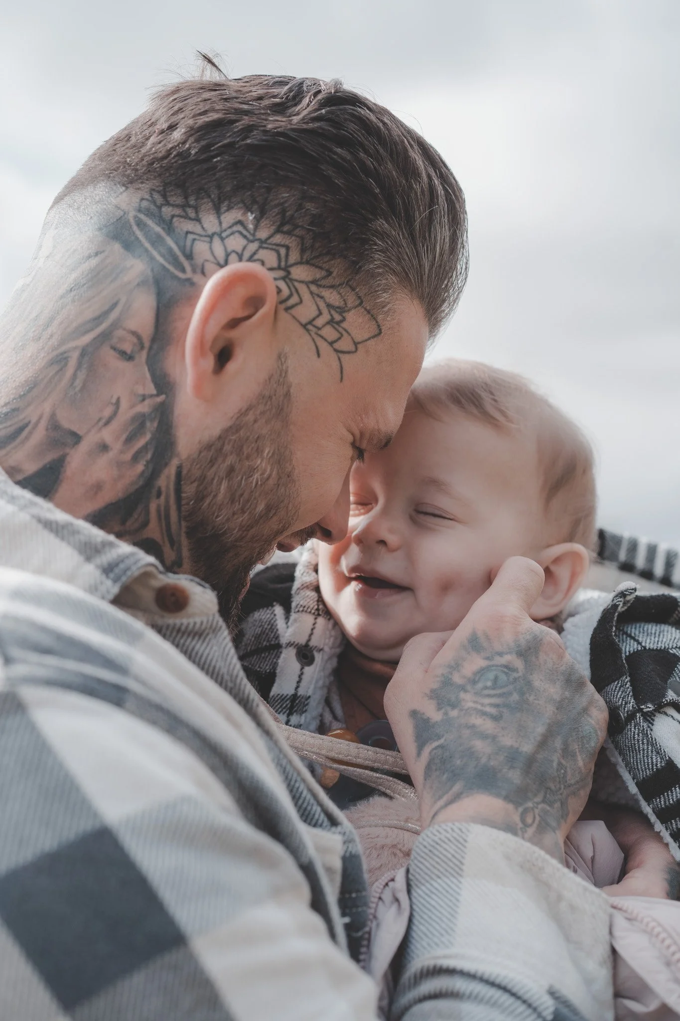 Father holding his baby son in his arms