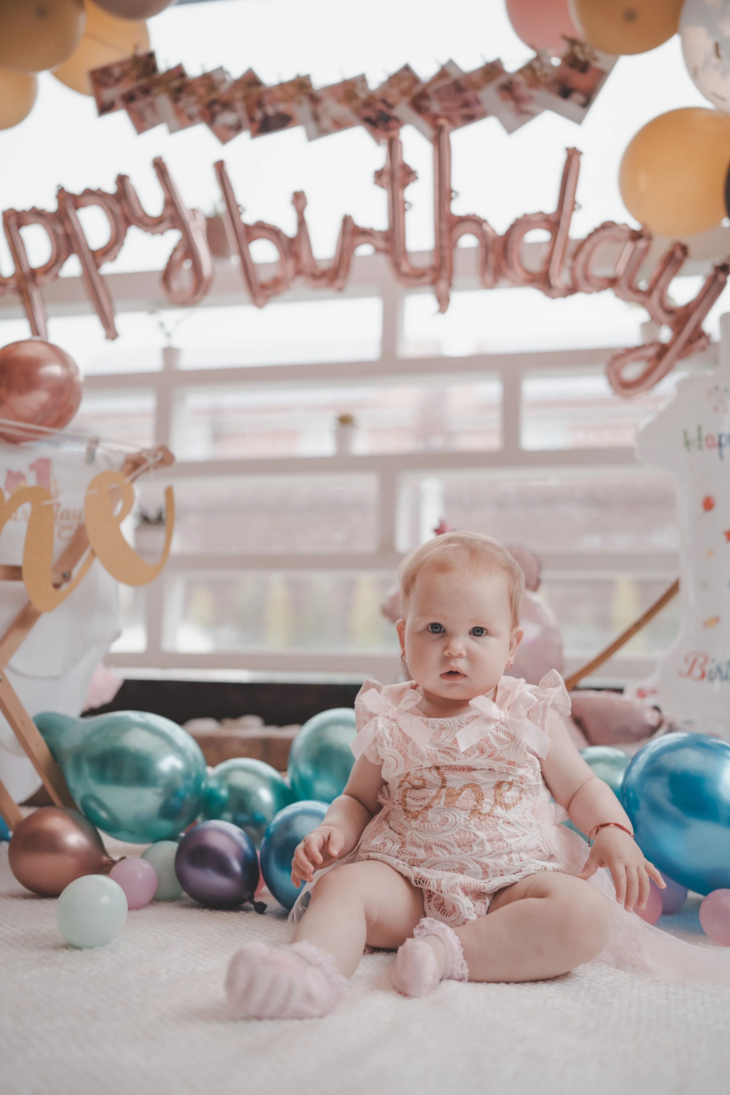 Portrait of a little girl at her 1st year birthday party