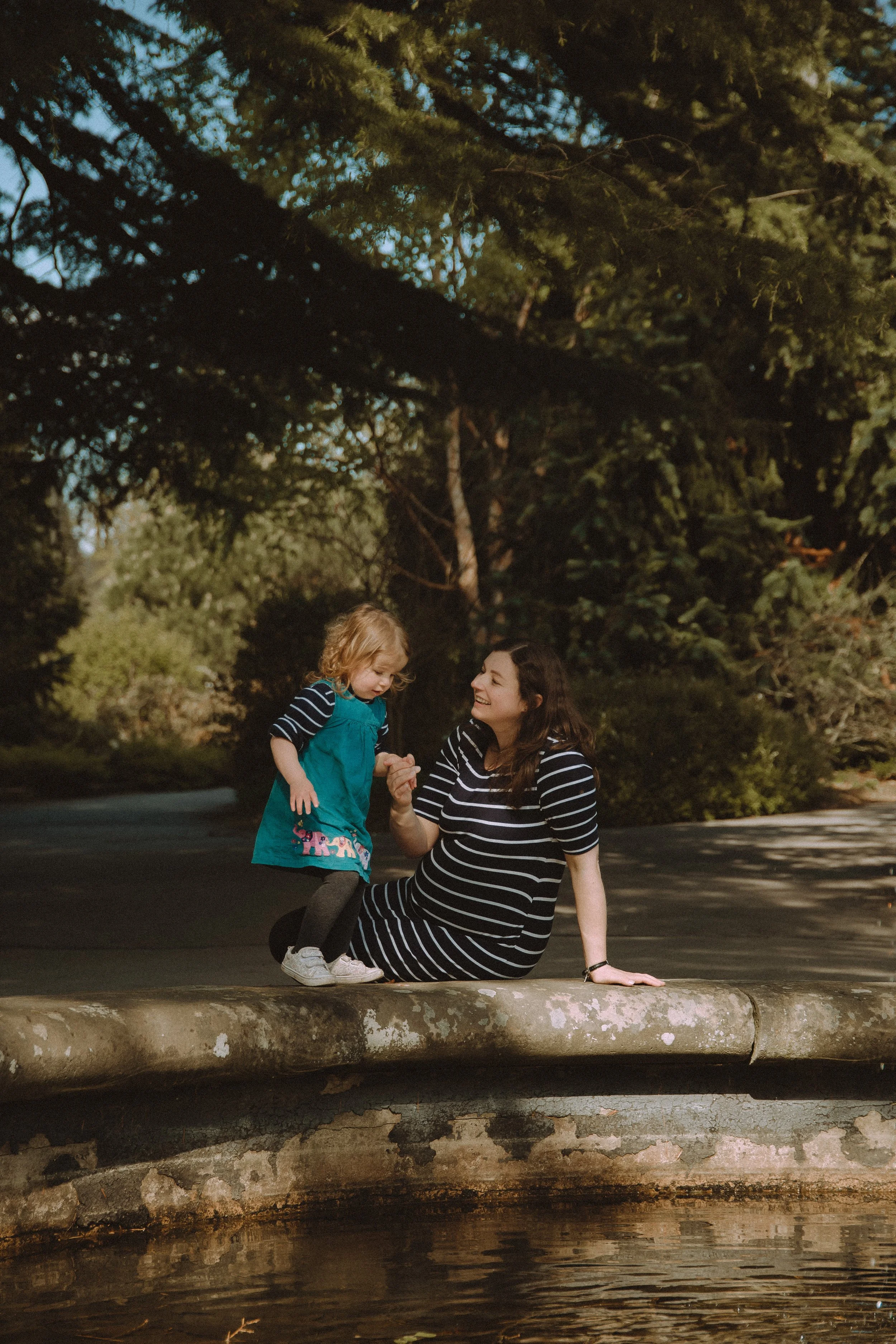 A mother and her child playing during a mommy and me photoshoot in Birmingham