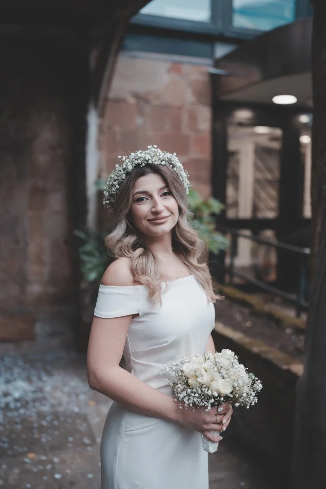 Young bride photographed in front of Cheylesmore Manor House, Coventry