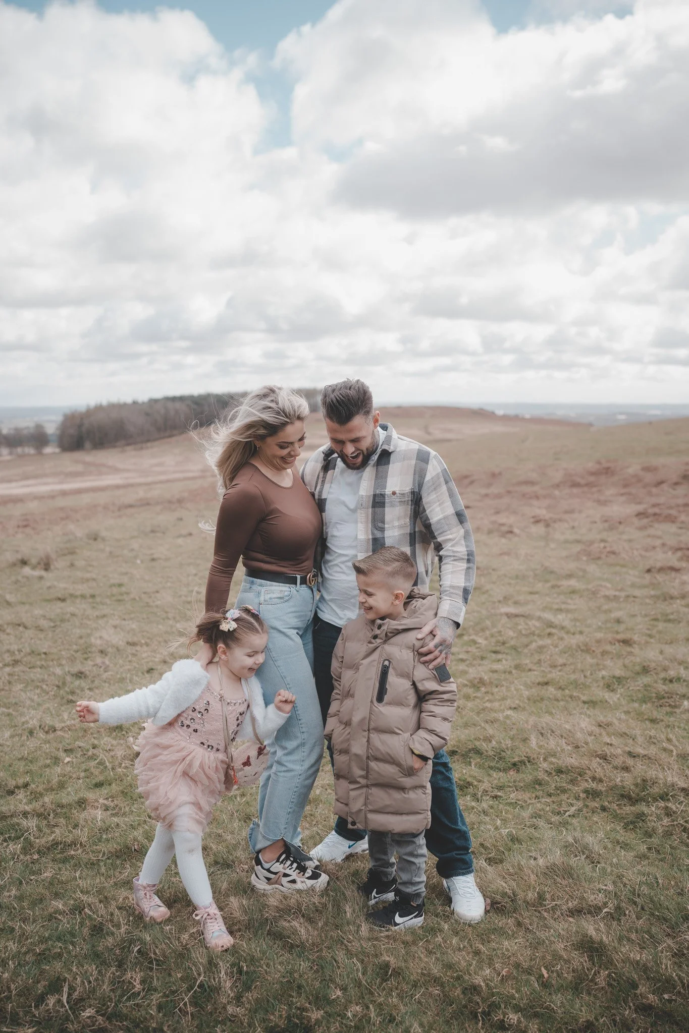 Portrait of two parents with their son and daughter at Bradgate Park, Leicester 