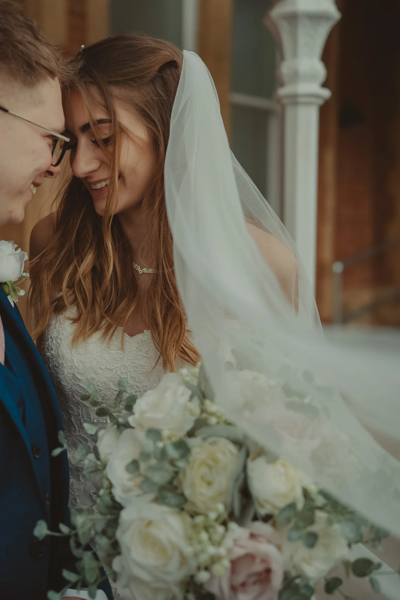 Intimate candid portrait of a youg couple of newly wedds at the Kent Register Office Oakwood House, Maidstone