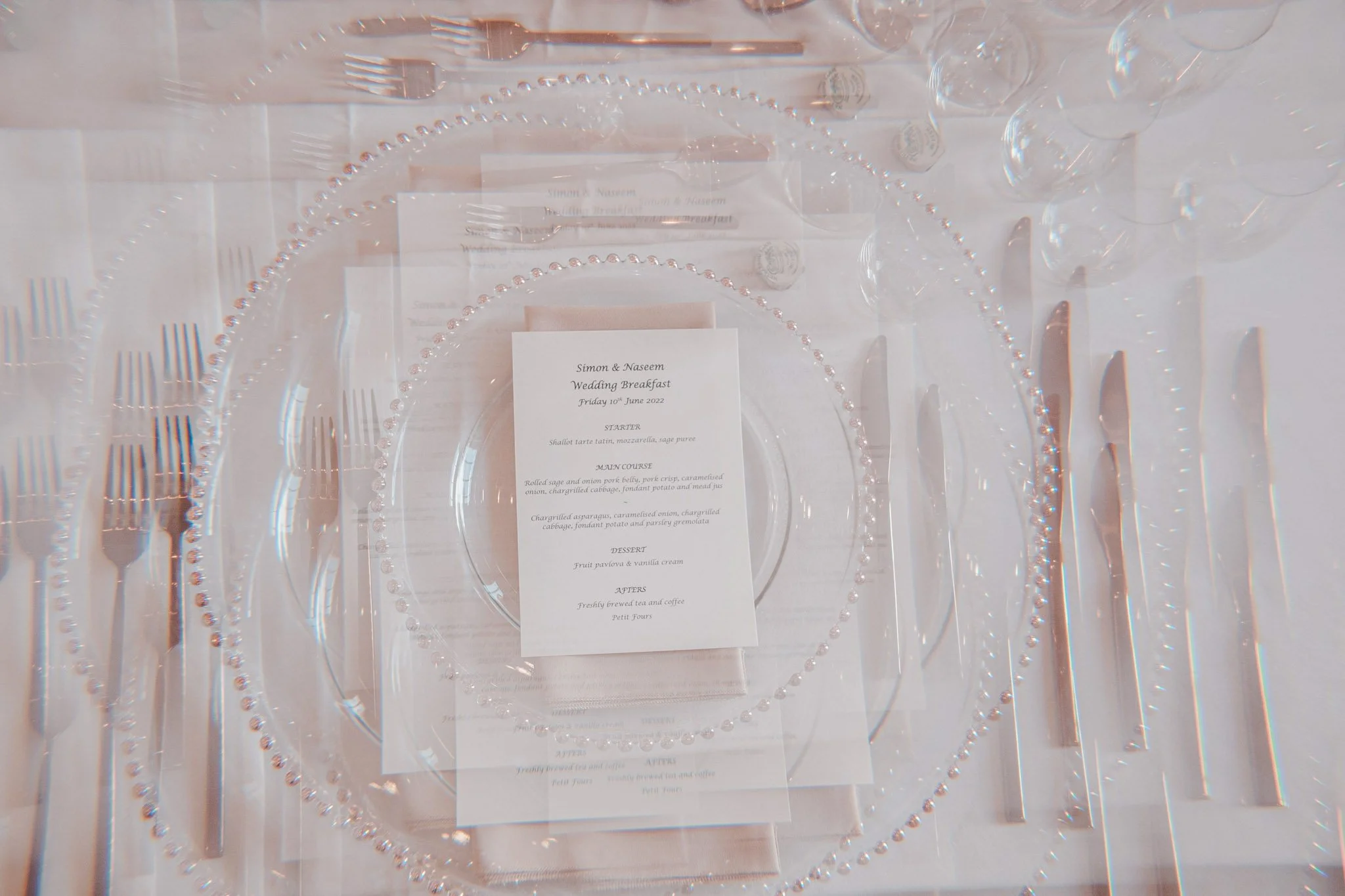Details of wedding menu and cutlery at wedding venue