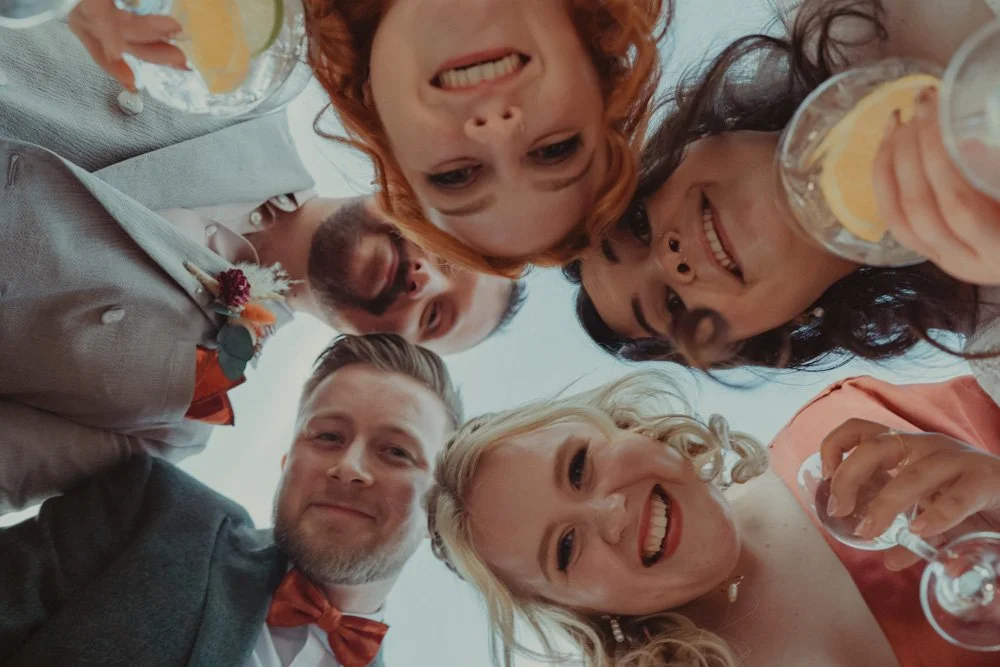Brides and their friends looking at the camera for above, for a portrait photography, at The Chester Fields Country Pub, Restaurant & Wedding Venue, UK