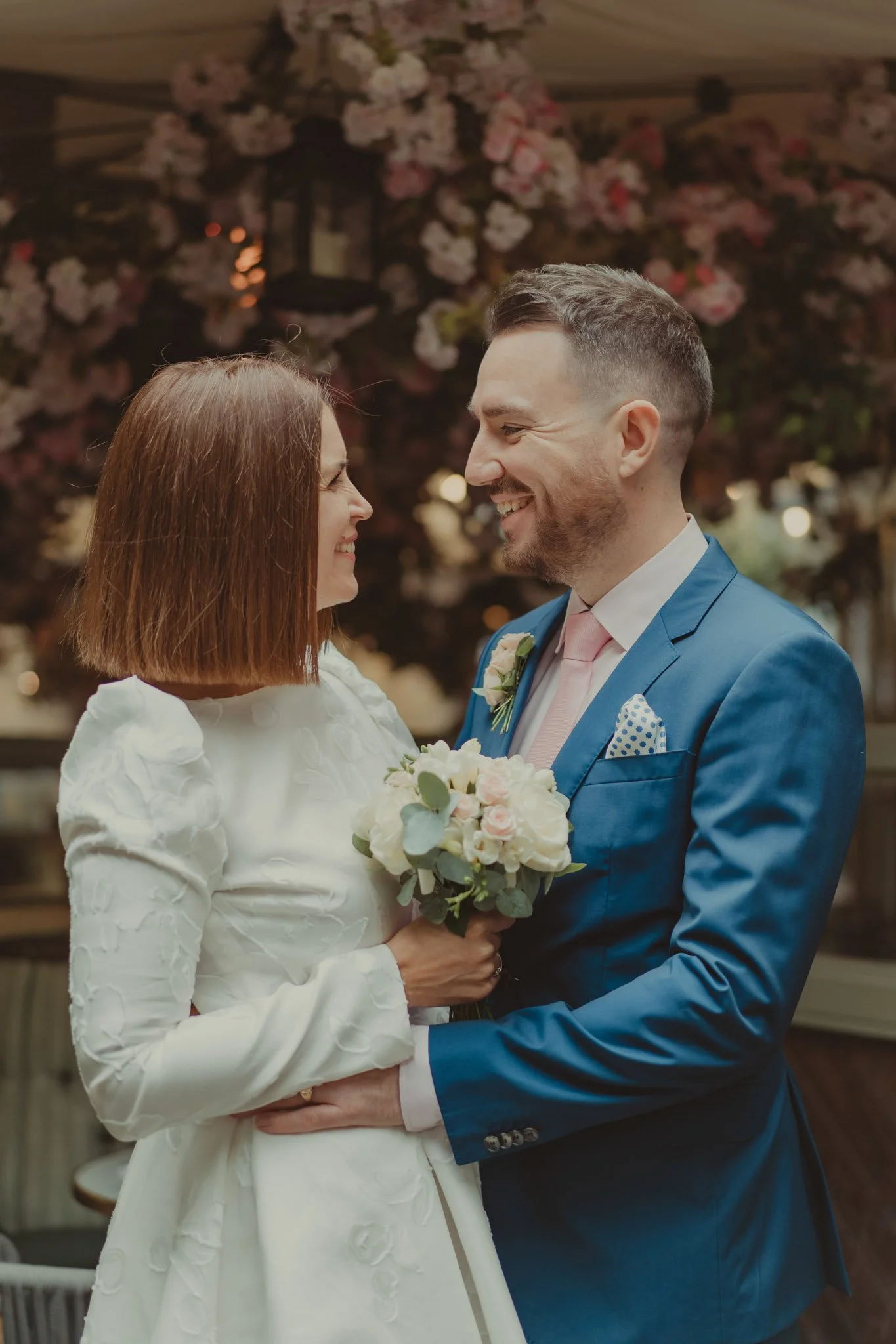 Bride and groom having a good time during their photoshoot on their wedding day