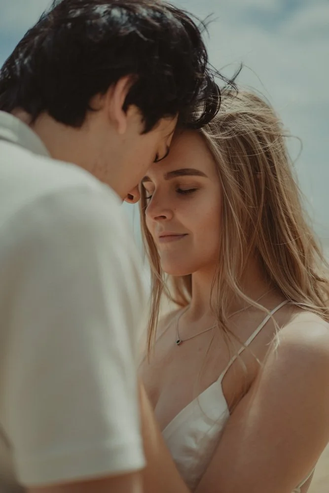 Close portrait of a girl and her boyfriend at their save the date photoshoot
