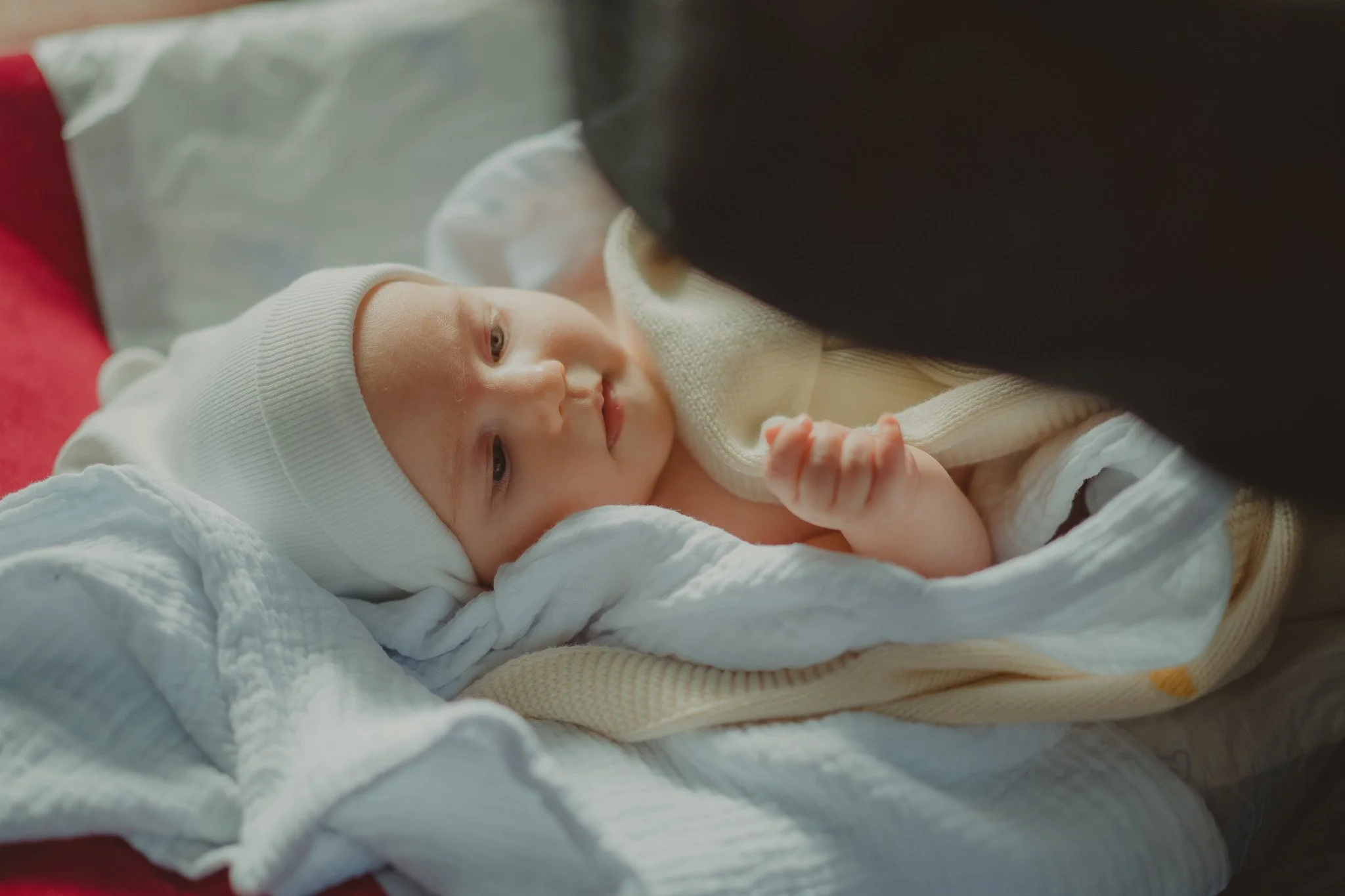 Little girl during her Christening ceremony at Biserica Naşterea Domnului, Cluj-Napoca, Romania