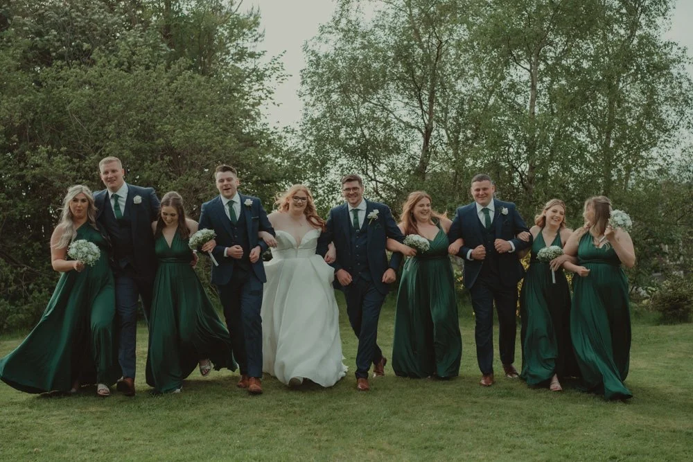 Wedding party fun group photo at The White Hart Inn at Lydgate