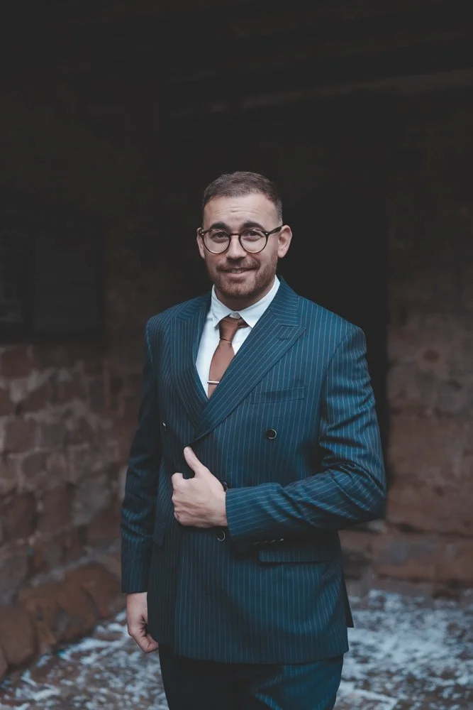 Portrait of groom in front of Cheylesmore Manor House, Coventry