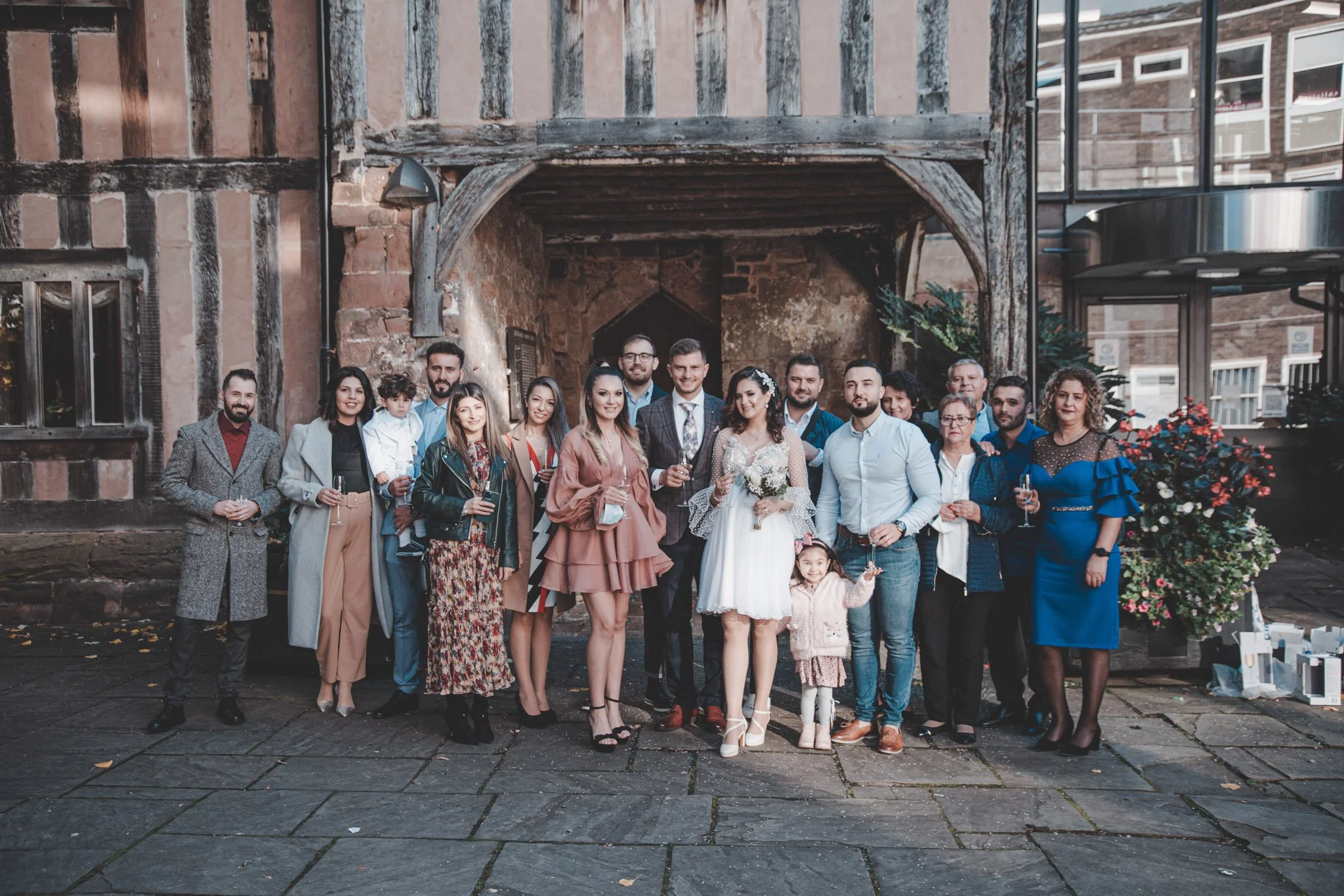 Group shoot in front of Cheylesmore Manor Ceremony Suite