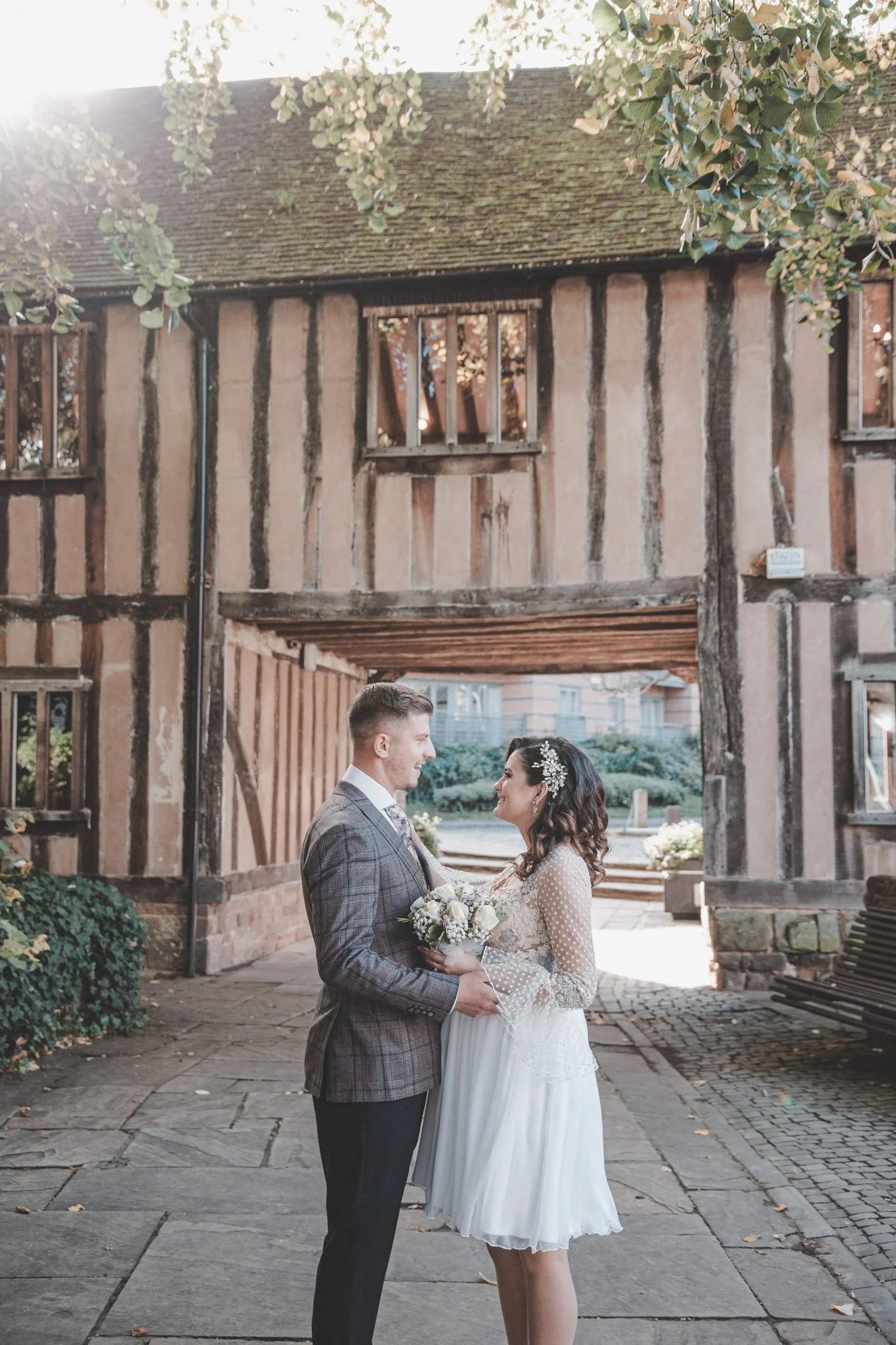 Bride and groom posing after their civil ceremony at Cheylesmore Manor Ceremony Suite Coventry