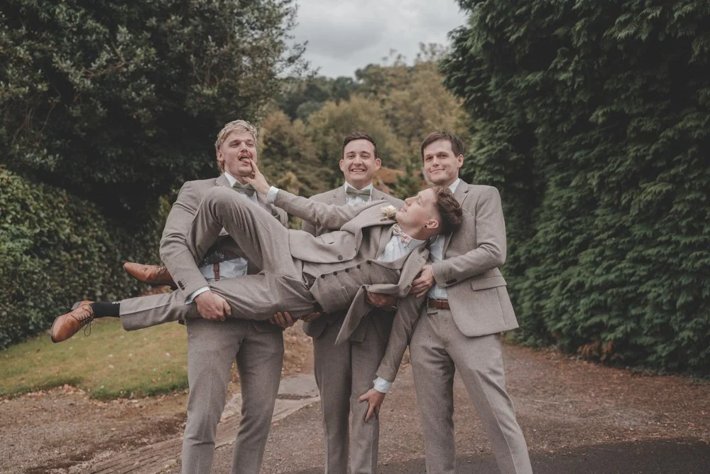 Funny photo of groom and groomsmen, at The Courtyard at Shelsley Walsh
