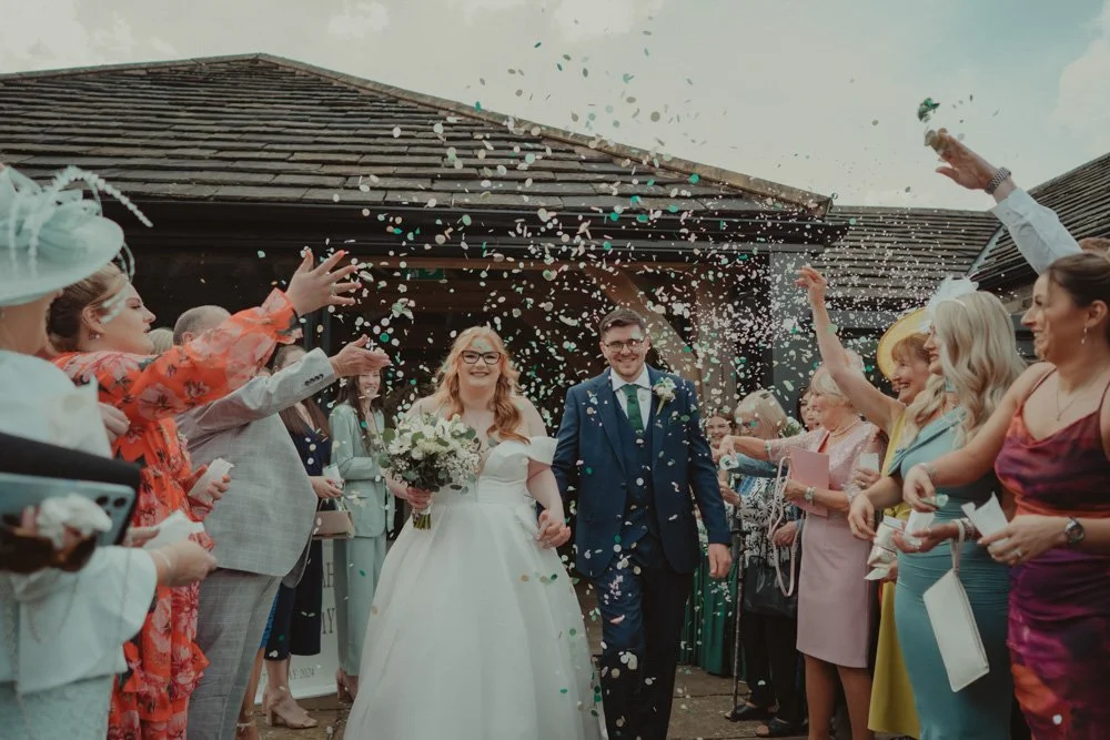 Confetti exit on wedding day The White Hart Inn at Lydgate