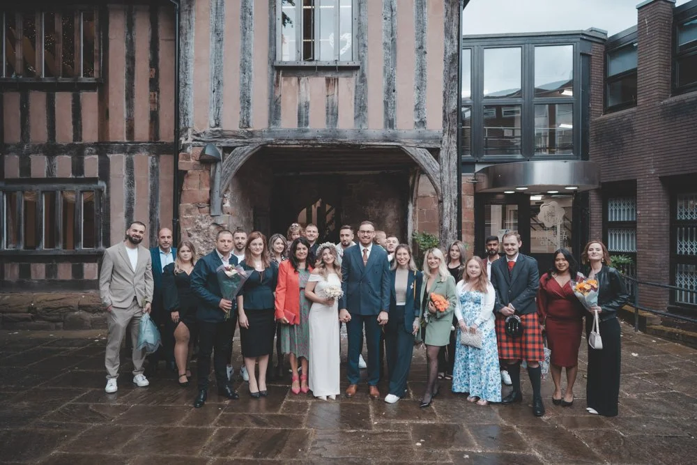 Wedding group photo in front of Cheylesmore Manor House, Coventry