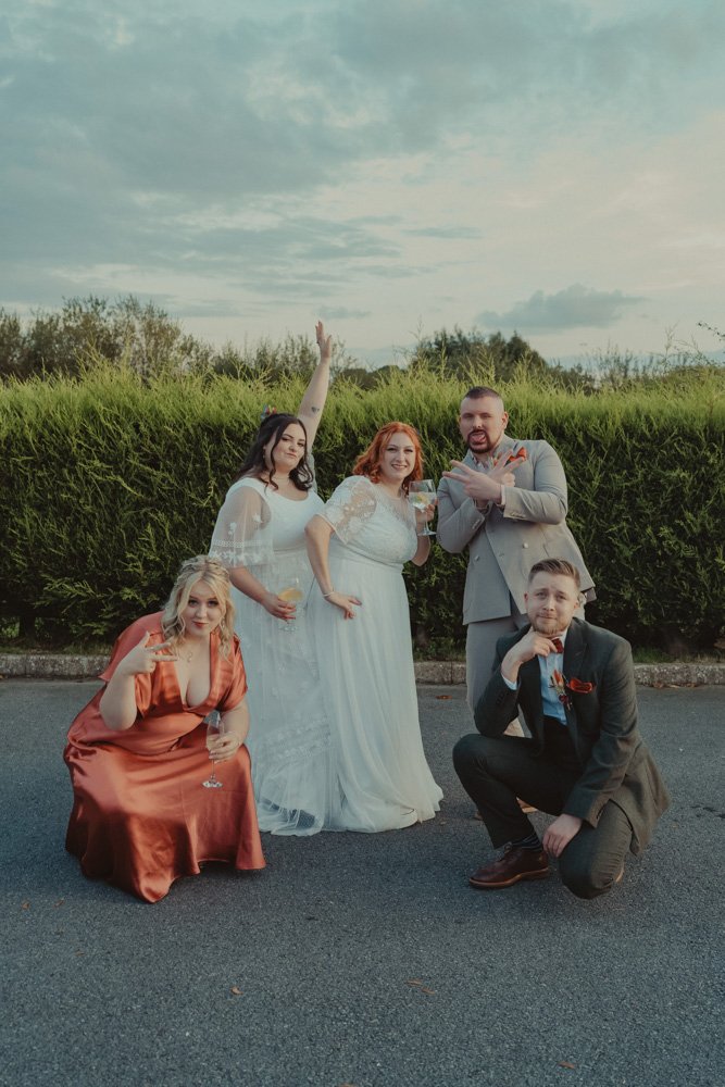 Brides and their friends at a LGBTQ wedding, at The Chester Fields Country Pub, Restaurant & Wedding Venue