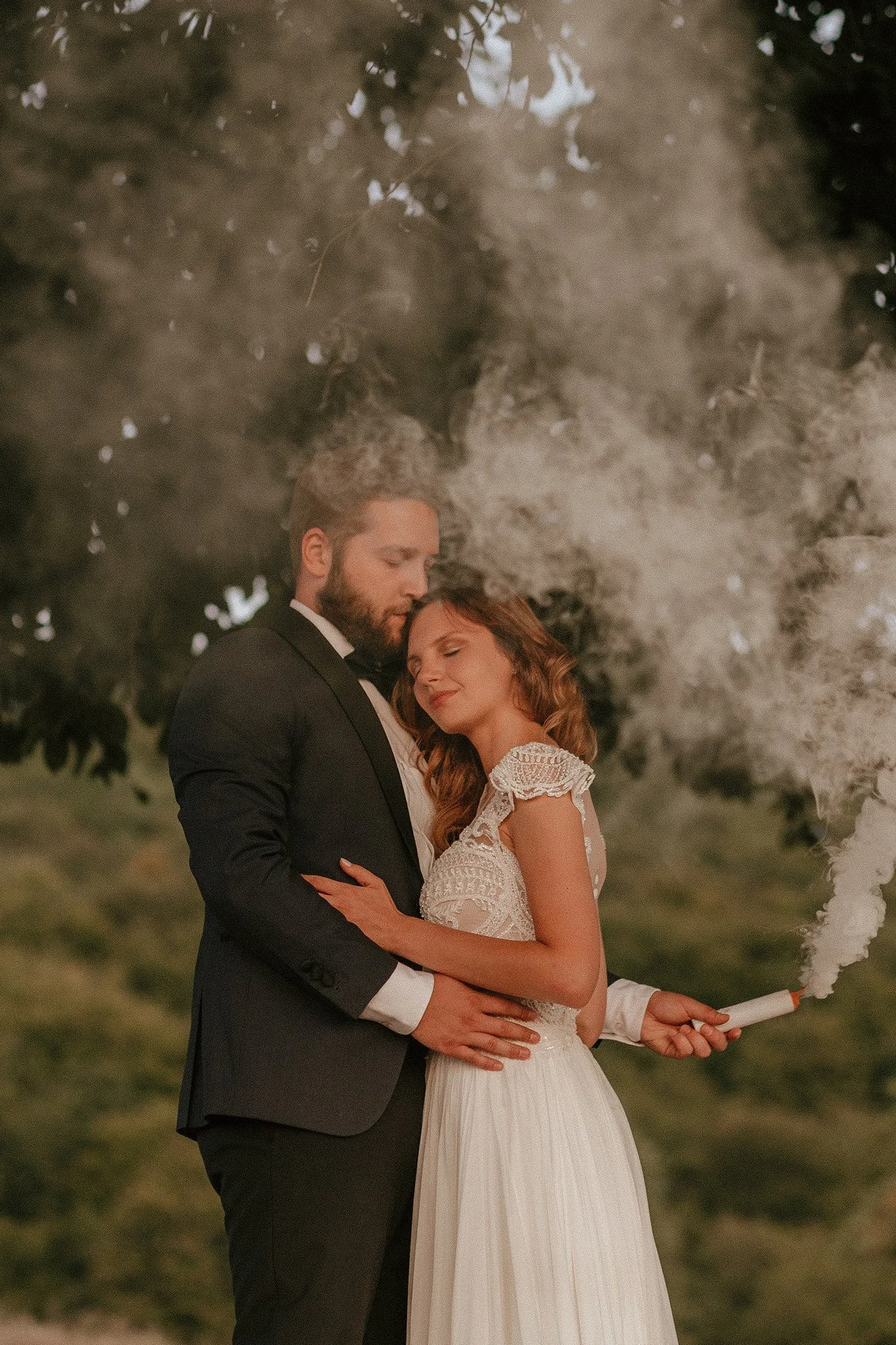 Color smoke bomb used in a trash the dress photoshoot