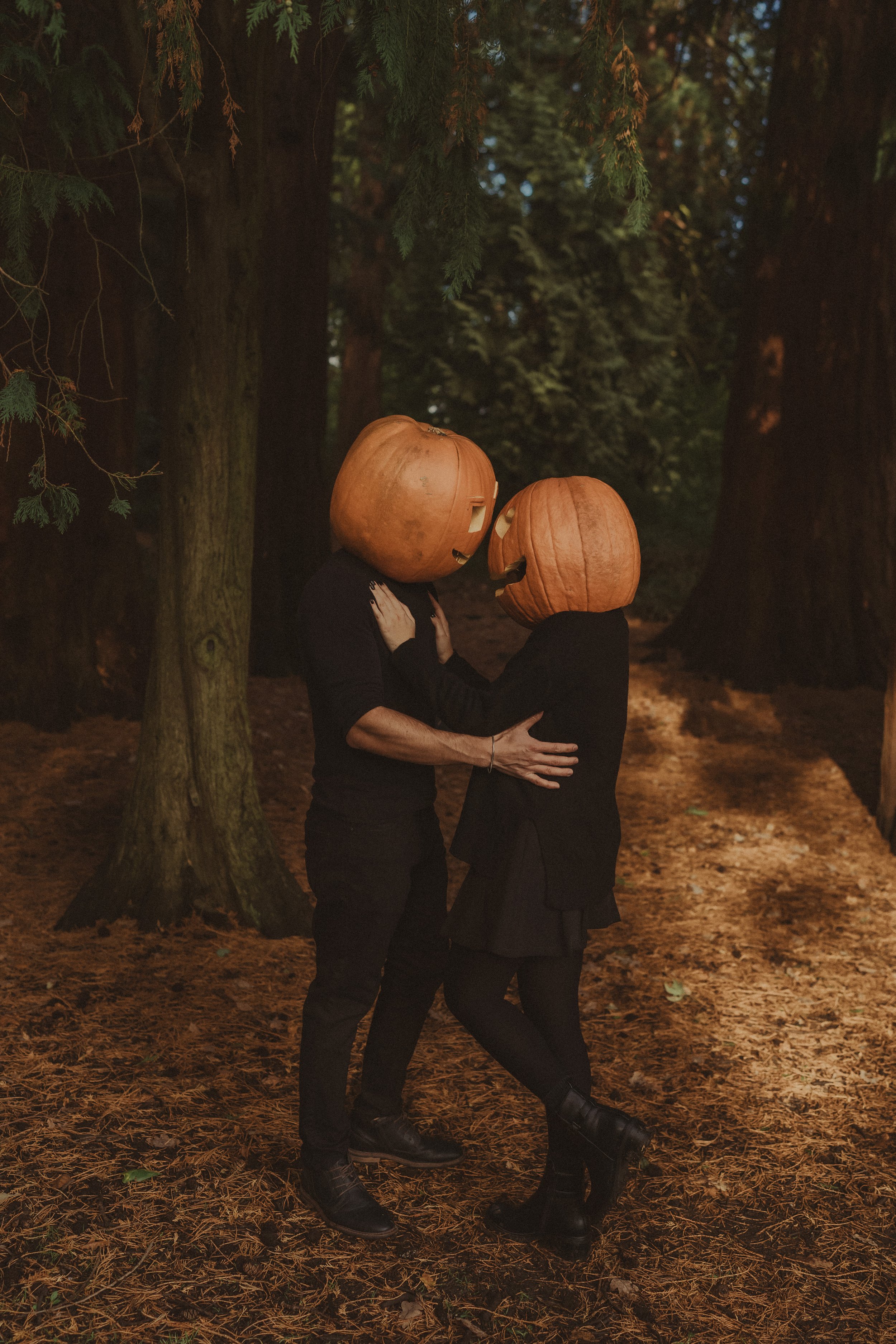 Vertical photo of a couple at a Halloween themed photo session, in Coombe Abbey Park, Coventry