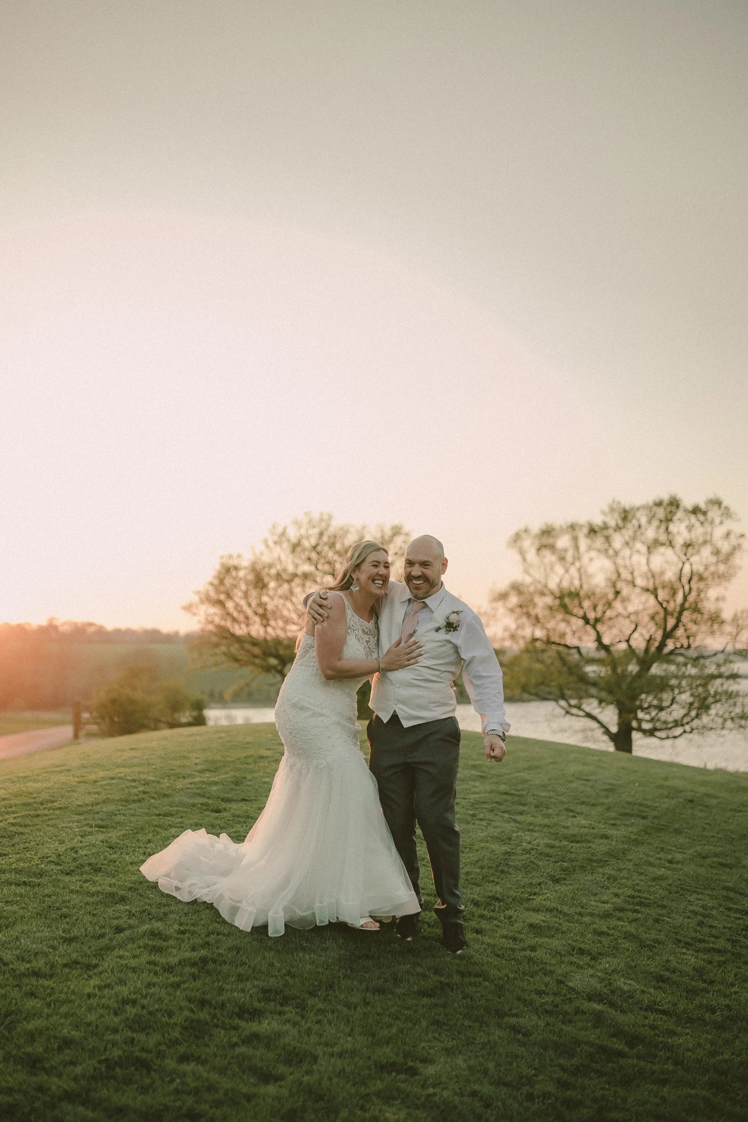 Newlyweds having fun together during the photoshoot in West Midlands