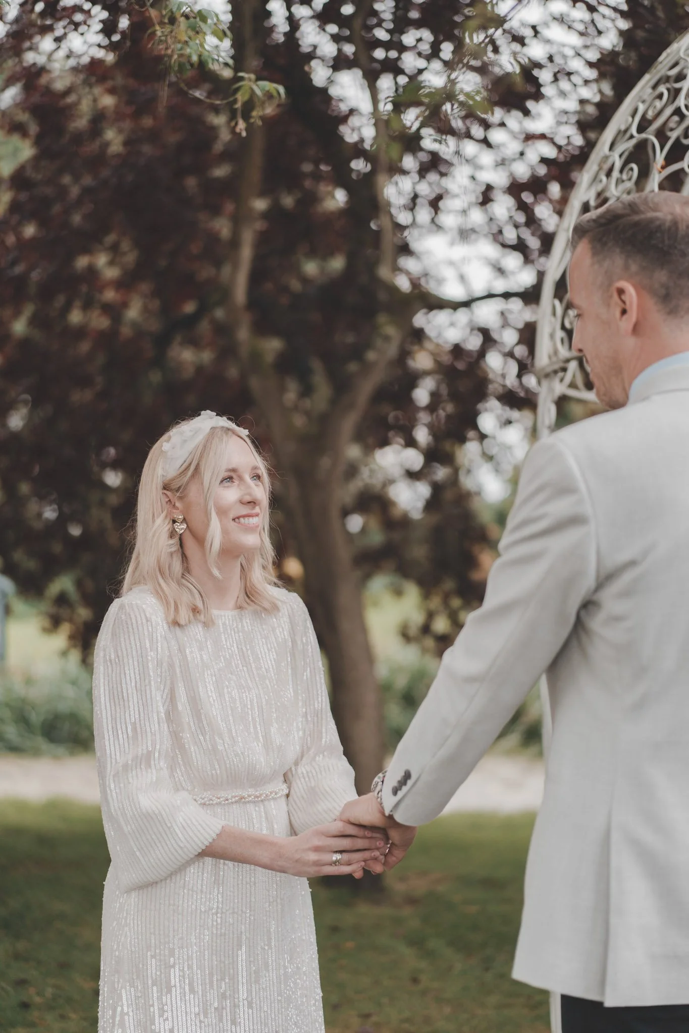 Bride smiling to her husband during their civil ceremony at Friars Court, Clanfield