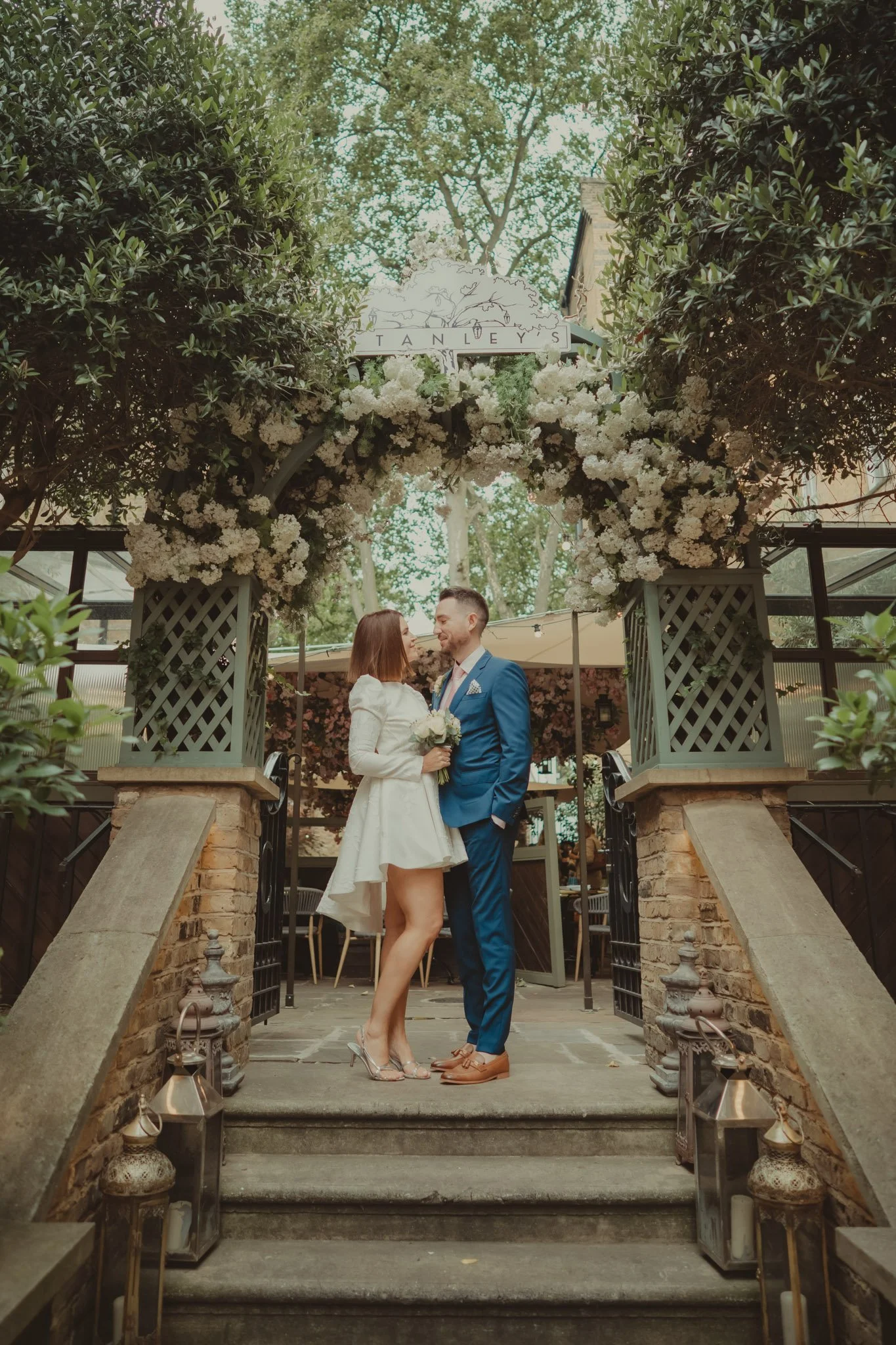Bride and groom during a small reception after their civil ceremony at Stanley's Restaurant in Chelsea, London