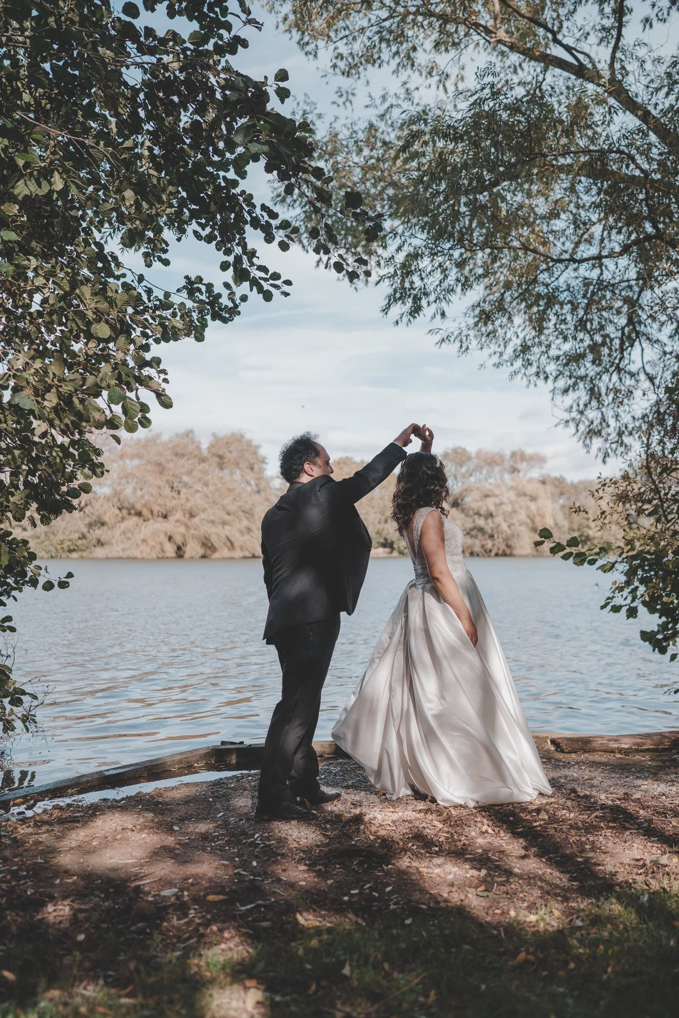 Newly wedds dancing on their wedding day at Delapre Lake, Northampton