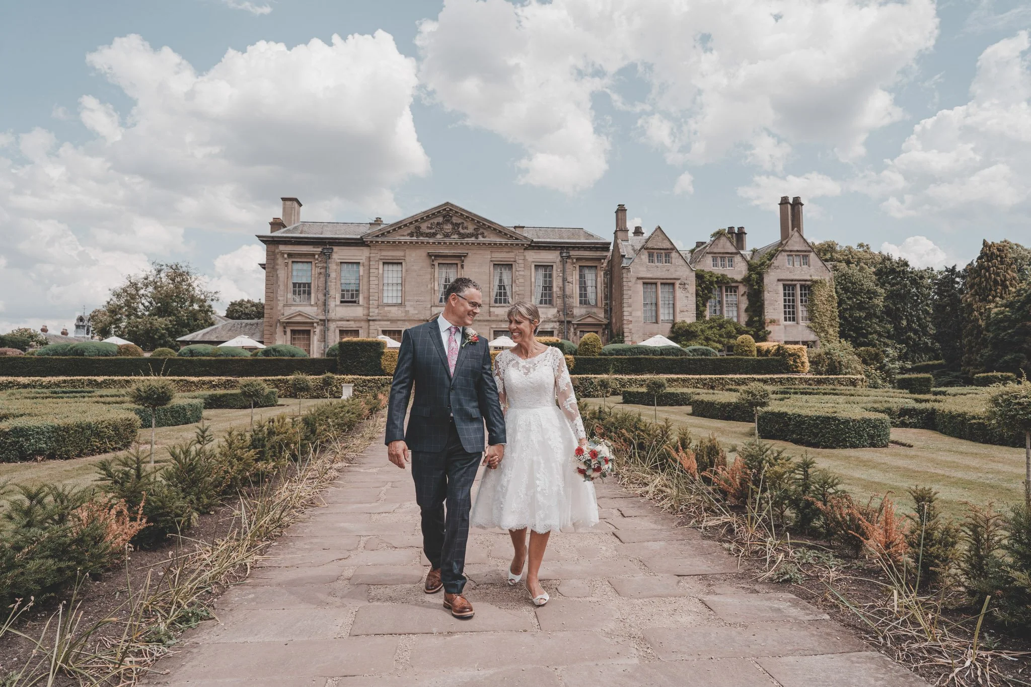 bride and groom captured after their civil ceremony at Coombe Abbey hotel, Coventry
