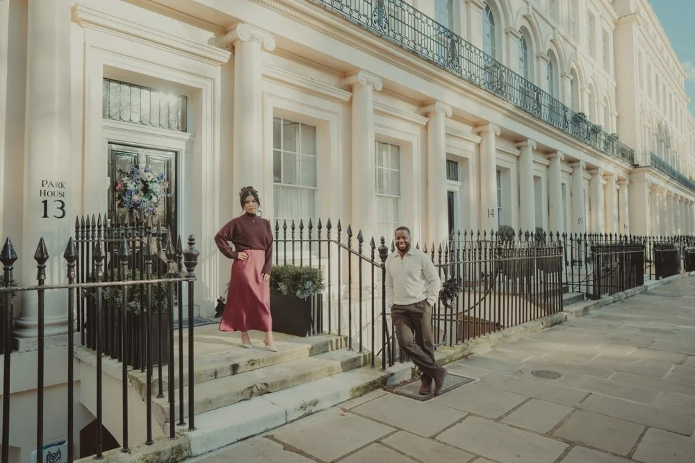 Couple posing for the camera on the posh streets of London, at their engagement photo session 