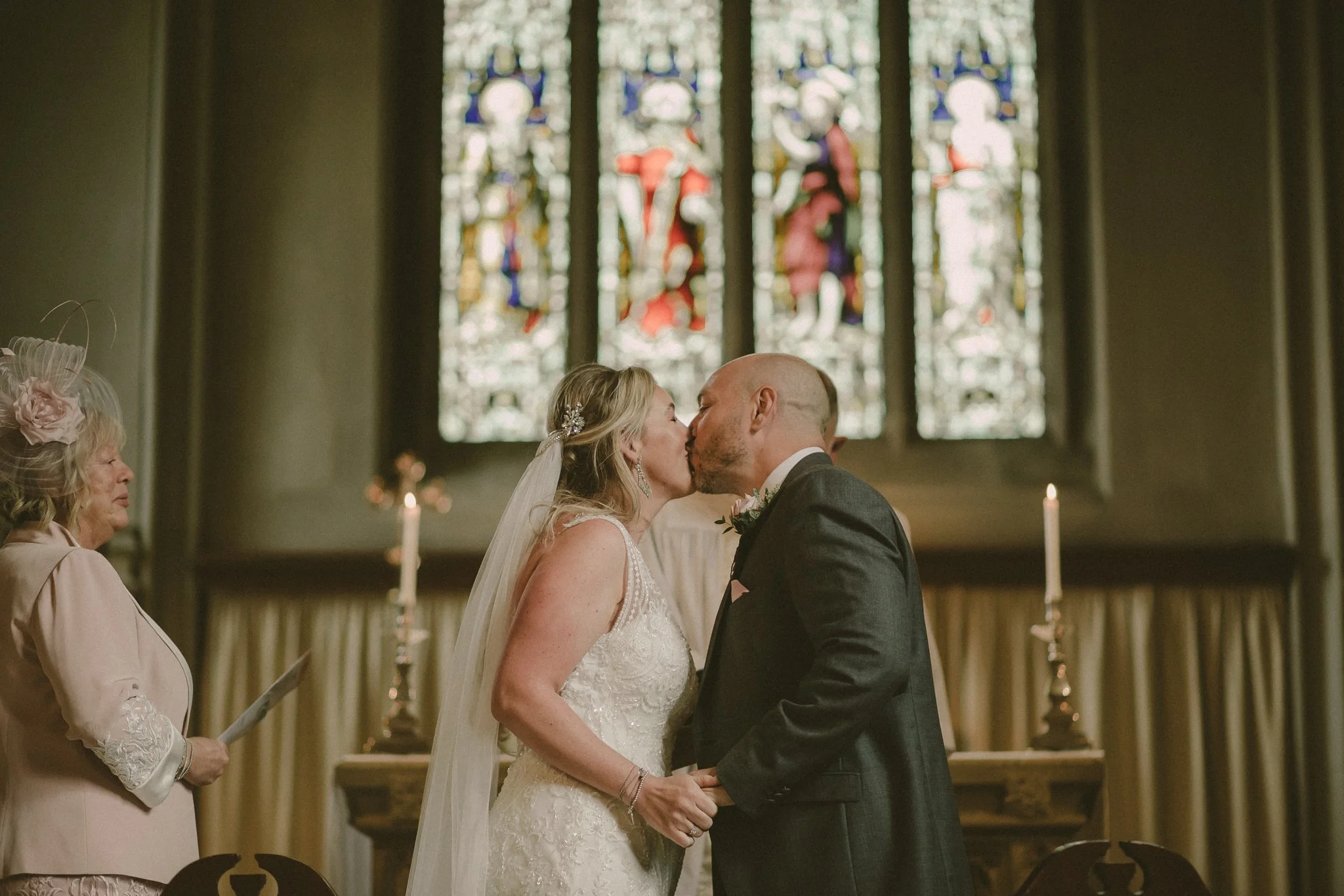 First kiss as a married couple in church in West Midlands