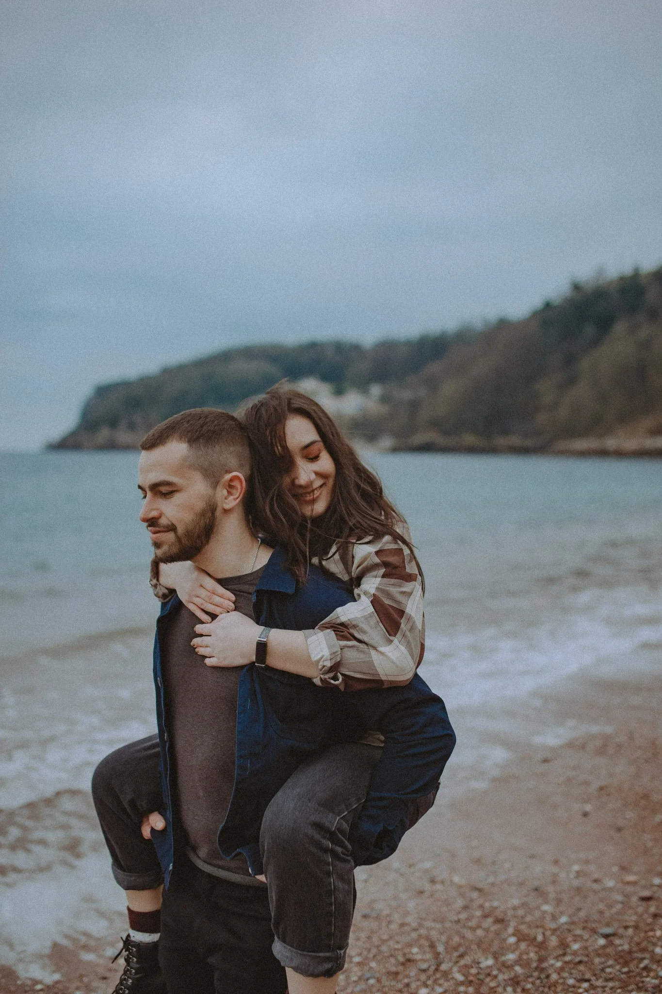 Couple having a genuine moment in front of the camera in Cornwall