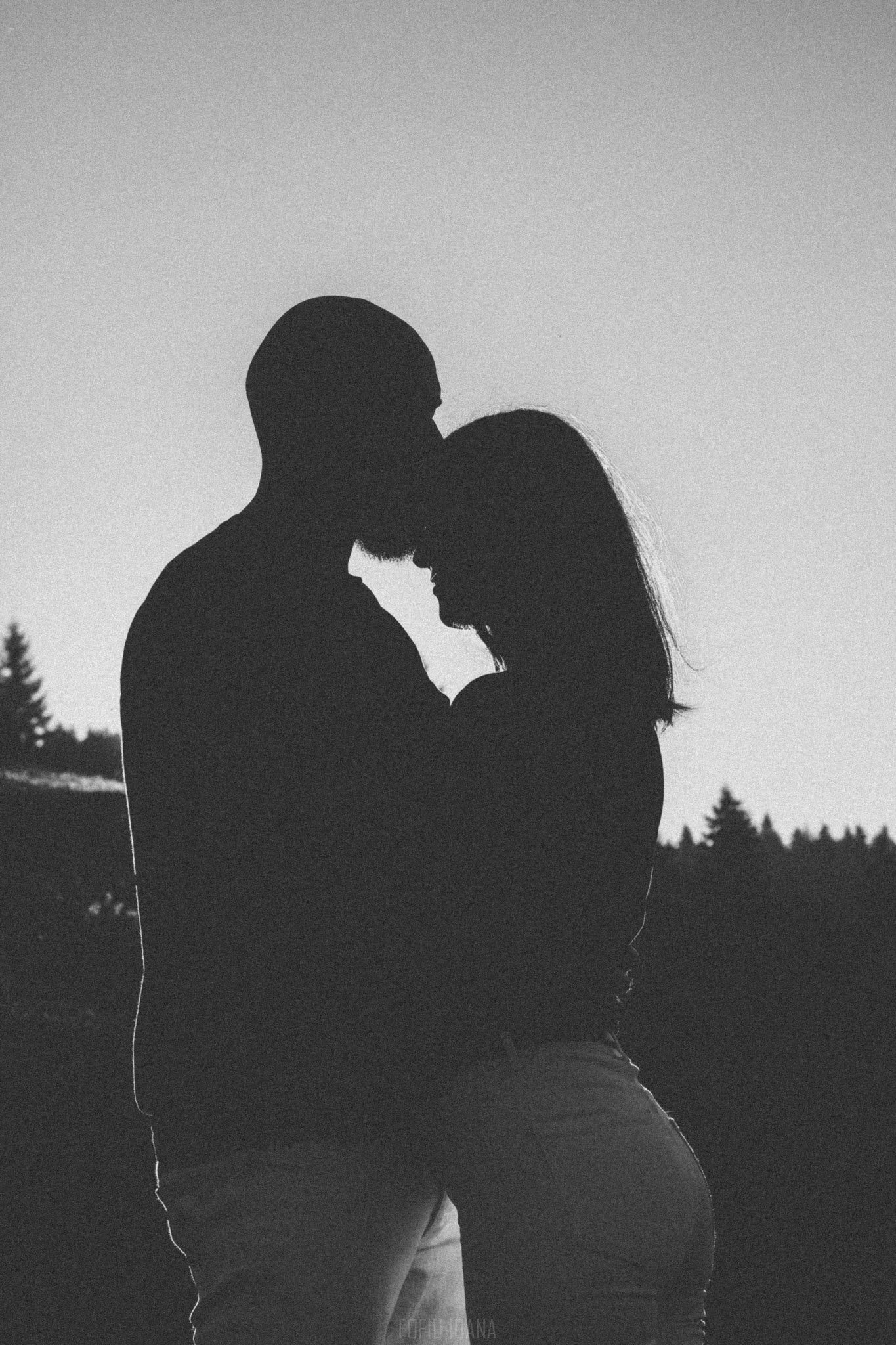 Genuine moment between a couple, during sunset, in black and white