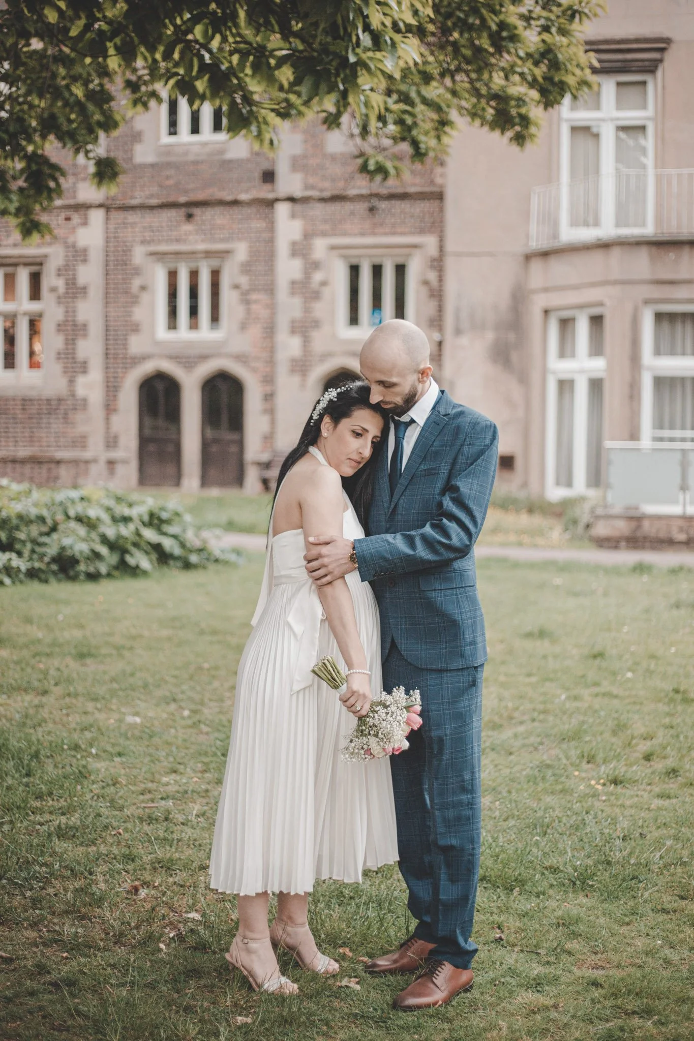 Outside photoshoot of bride and groom right after their wedding ceremony in Warwickshire