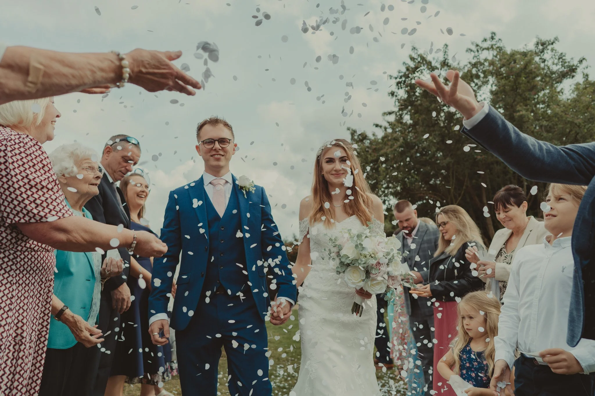 Bride and groom during the confetti shot at the Kent Register Office Oakwood House, Maidstone