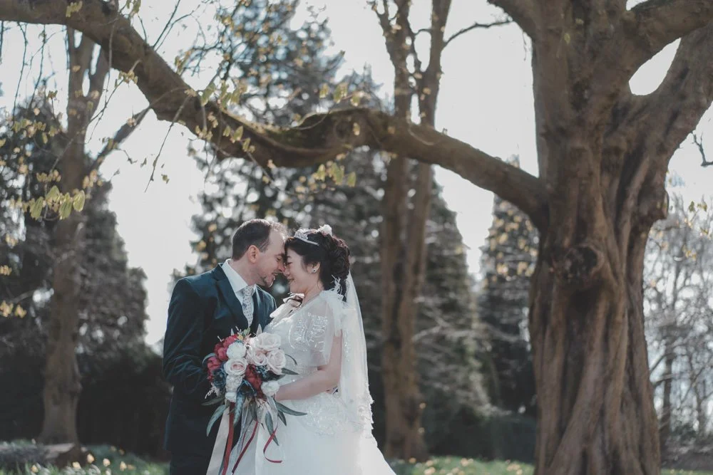 Portrait of a bride and groom in Nottingham University Park