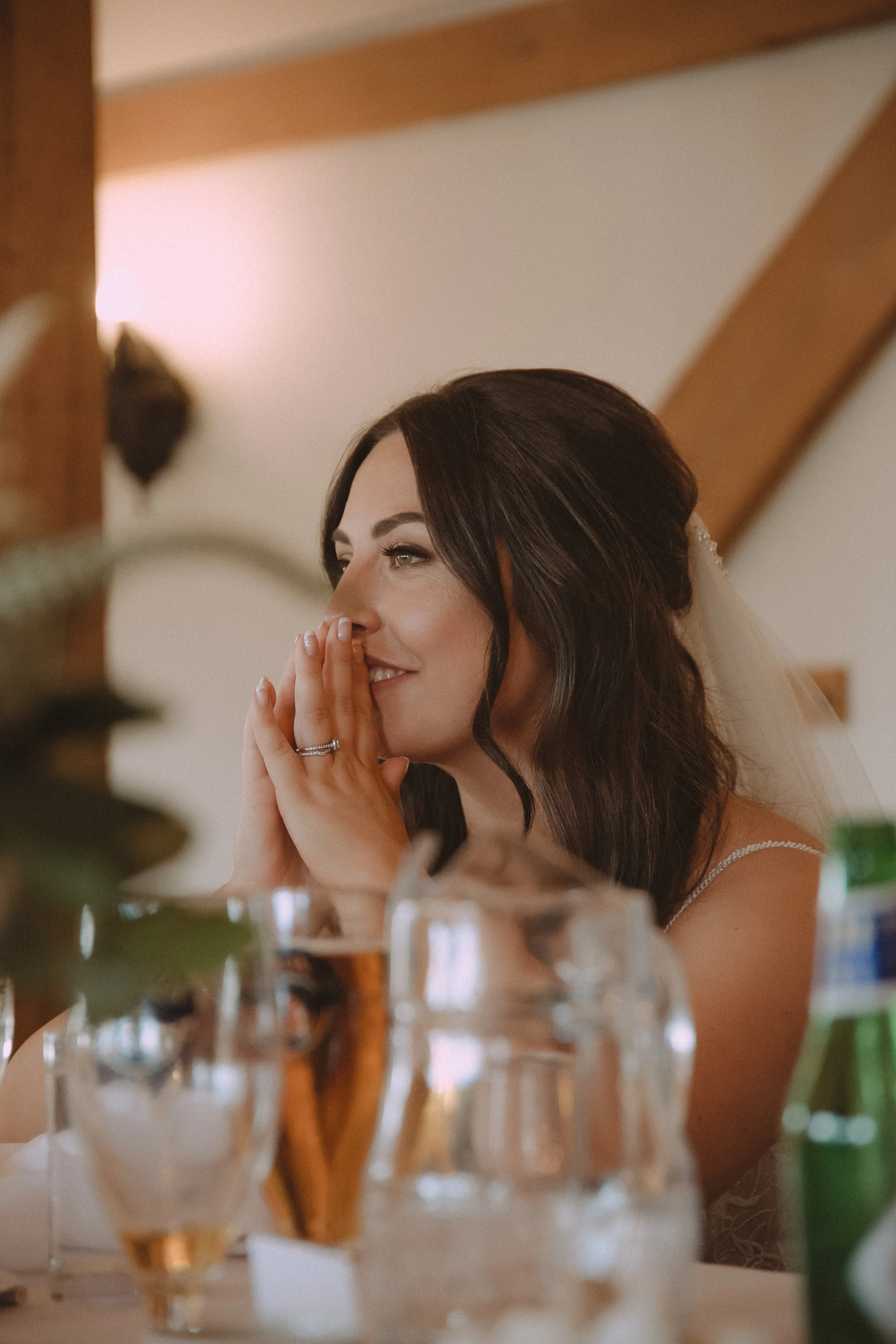 Portrait of the bride during speeches at Sandhole Oak Barn Wedding Venue