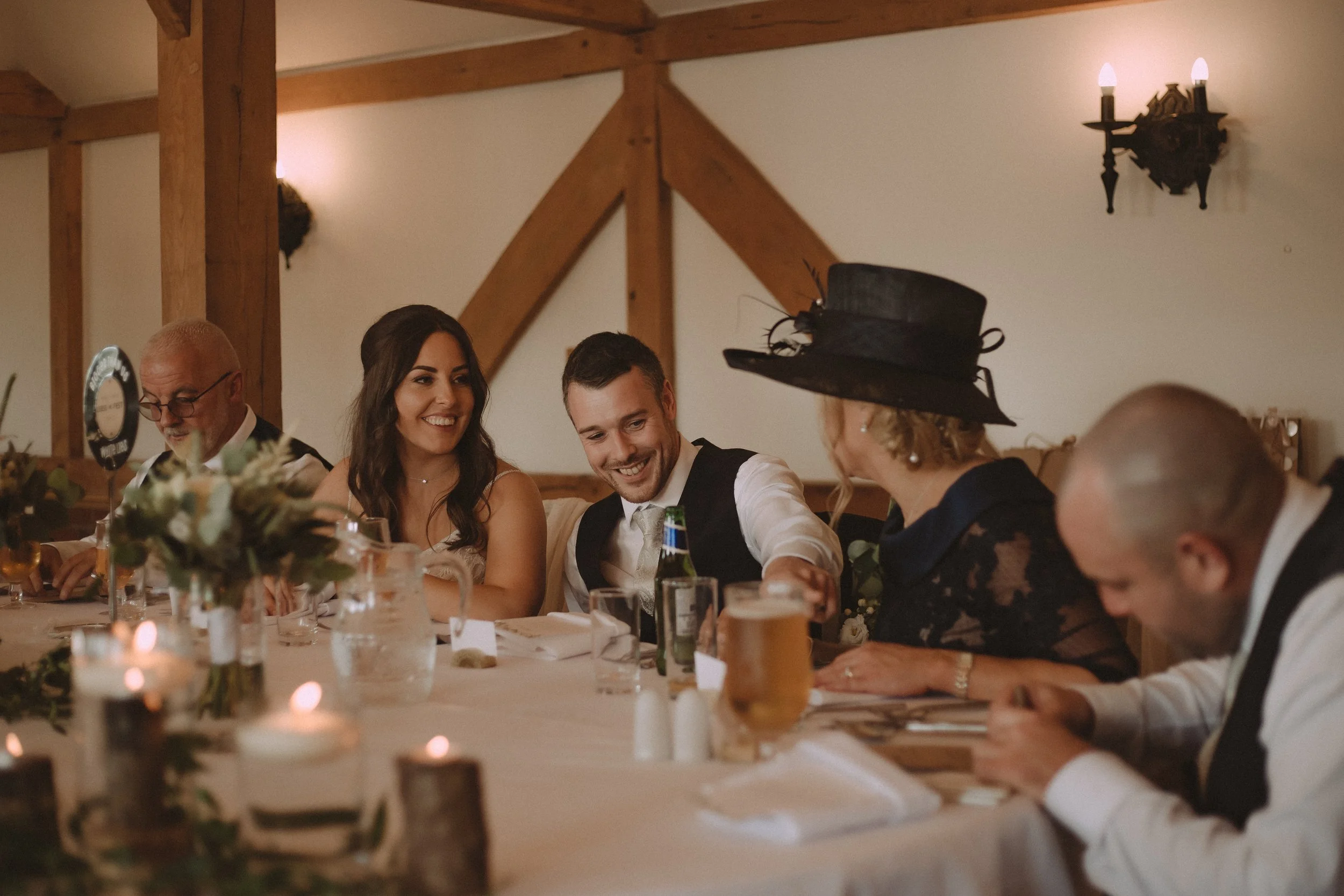 Beide, groom and guests having a good time on their wedding day at Sandhole Oak Barn Wedding Venue 
