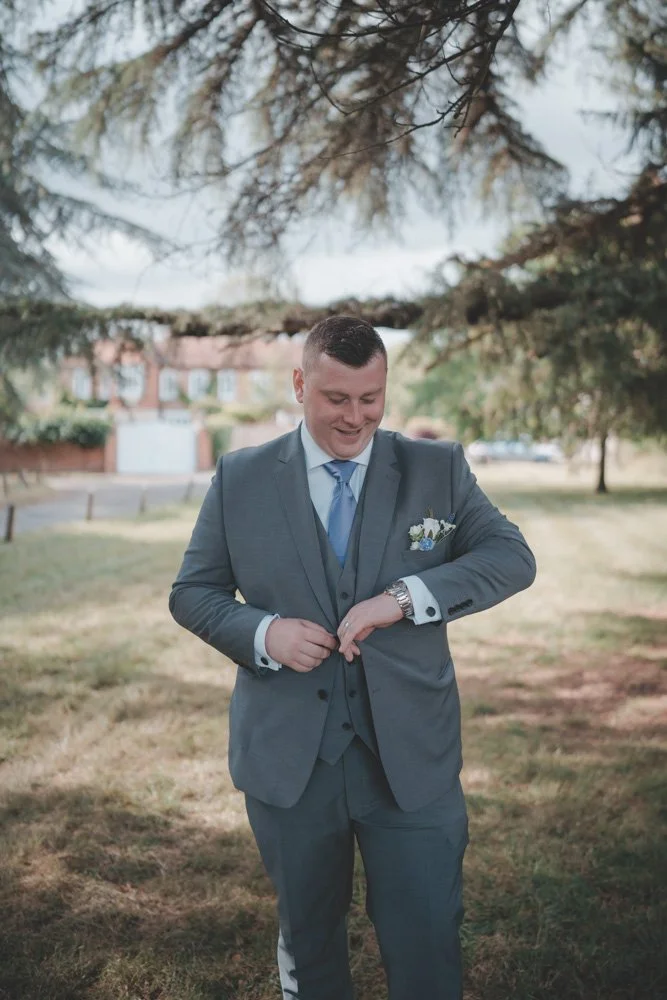 Vertical portrait of a groom at Monks Barn, Hurley, UK