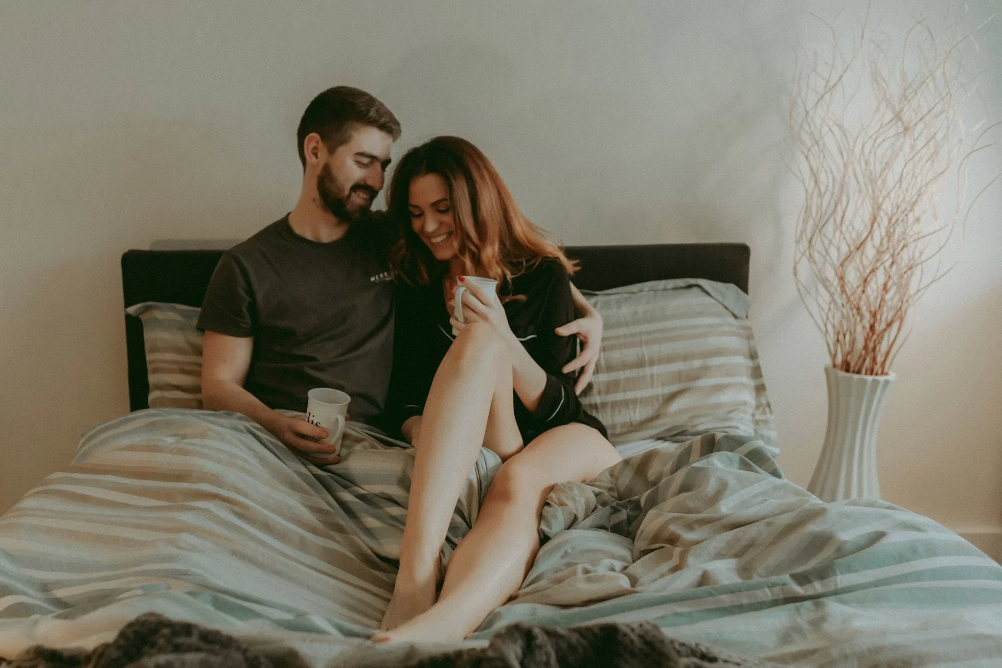 Couple photographed in their bedroom