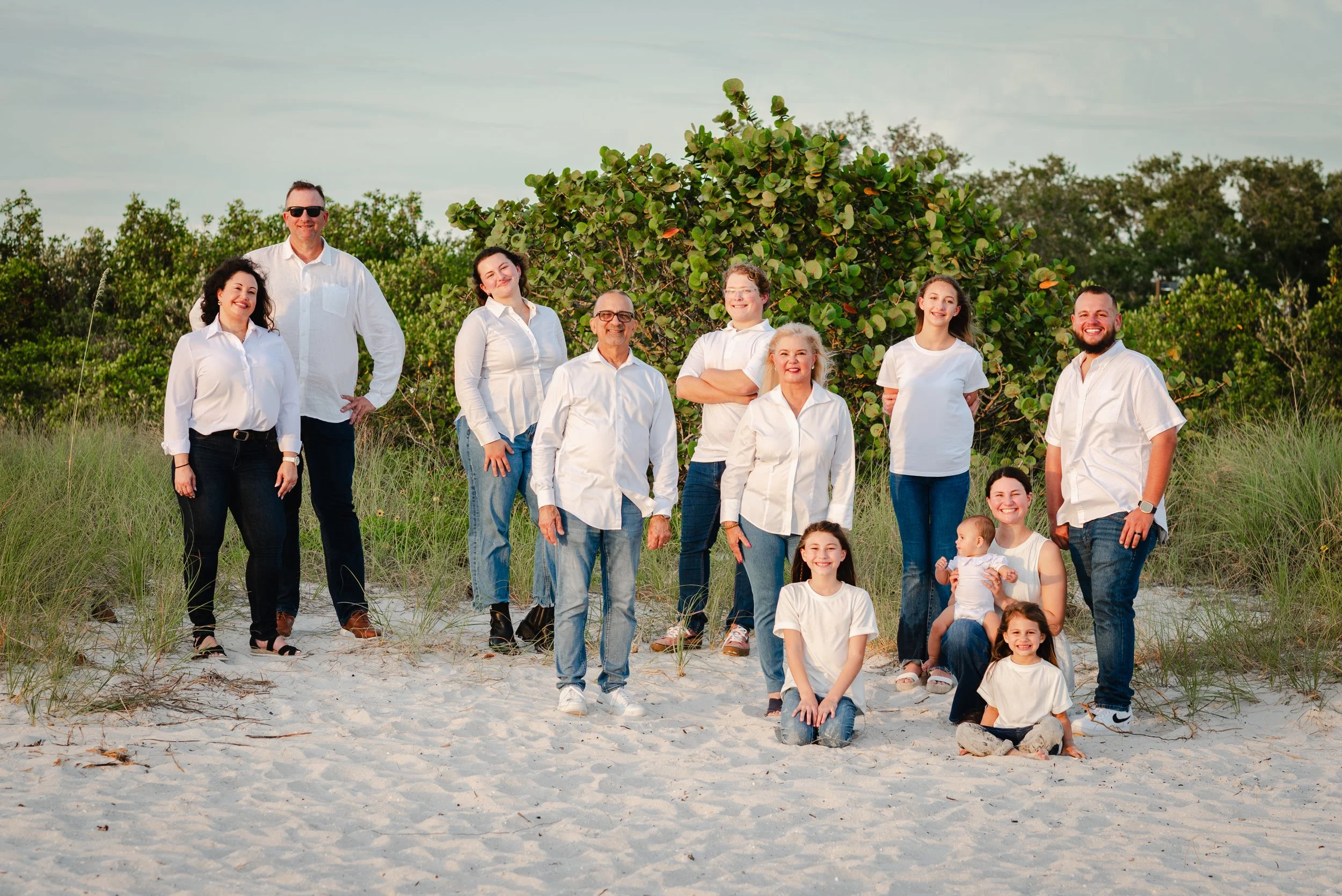 Family group portrait among sea grapes and dunes at Cypress Point Park, FL