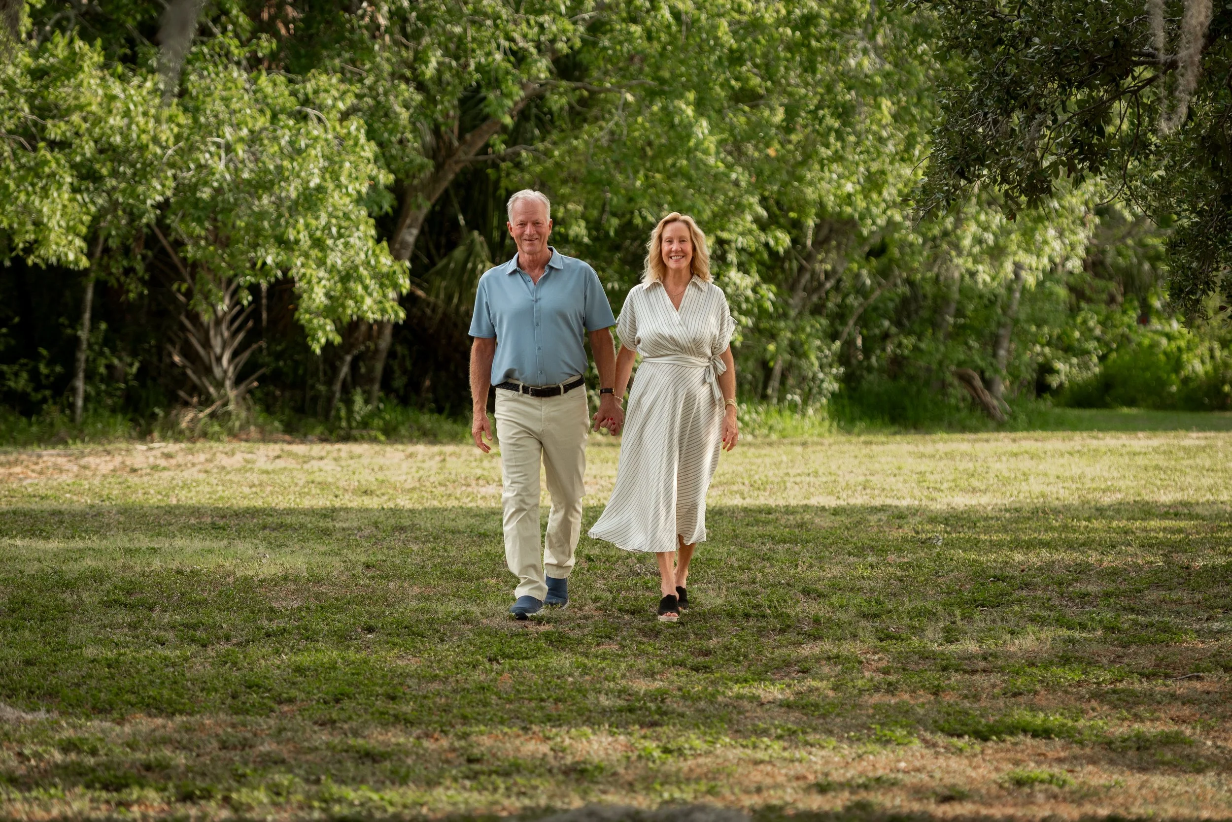 Grandparents walking hand in hand at Hammock Park, Dunedin FL 40th anniversary session