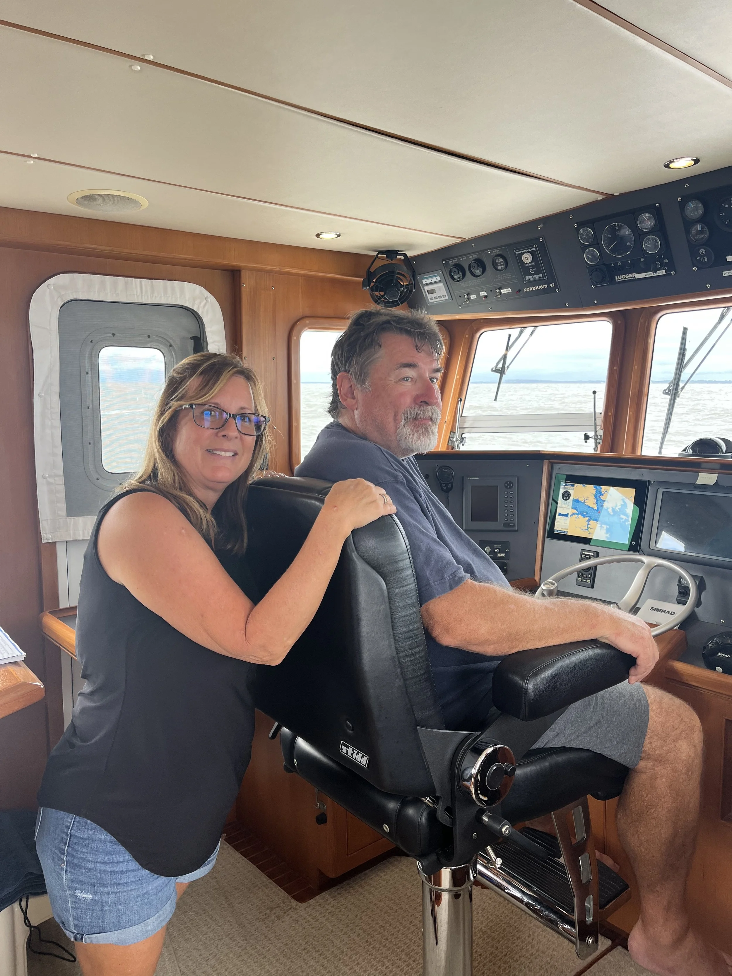 Couple receiving private couples boat training aboard their vessel with Capt'n 4 Hire