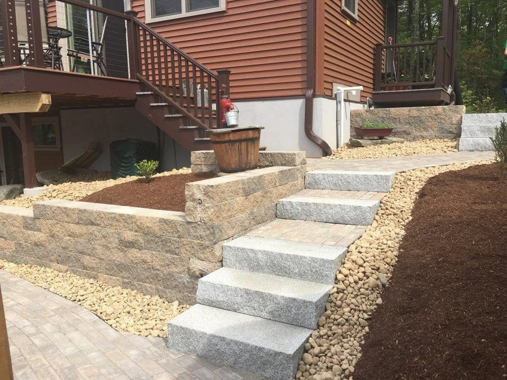 Granite steps with retaining walls and walkways.
