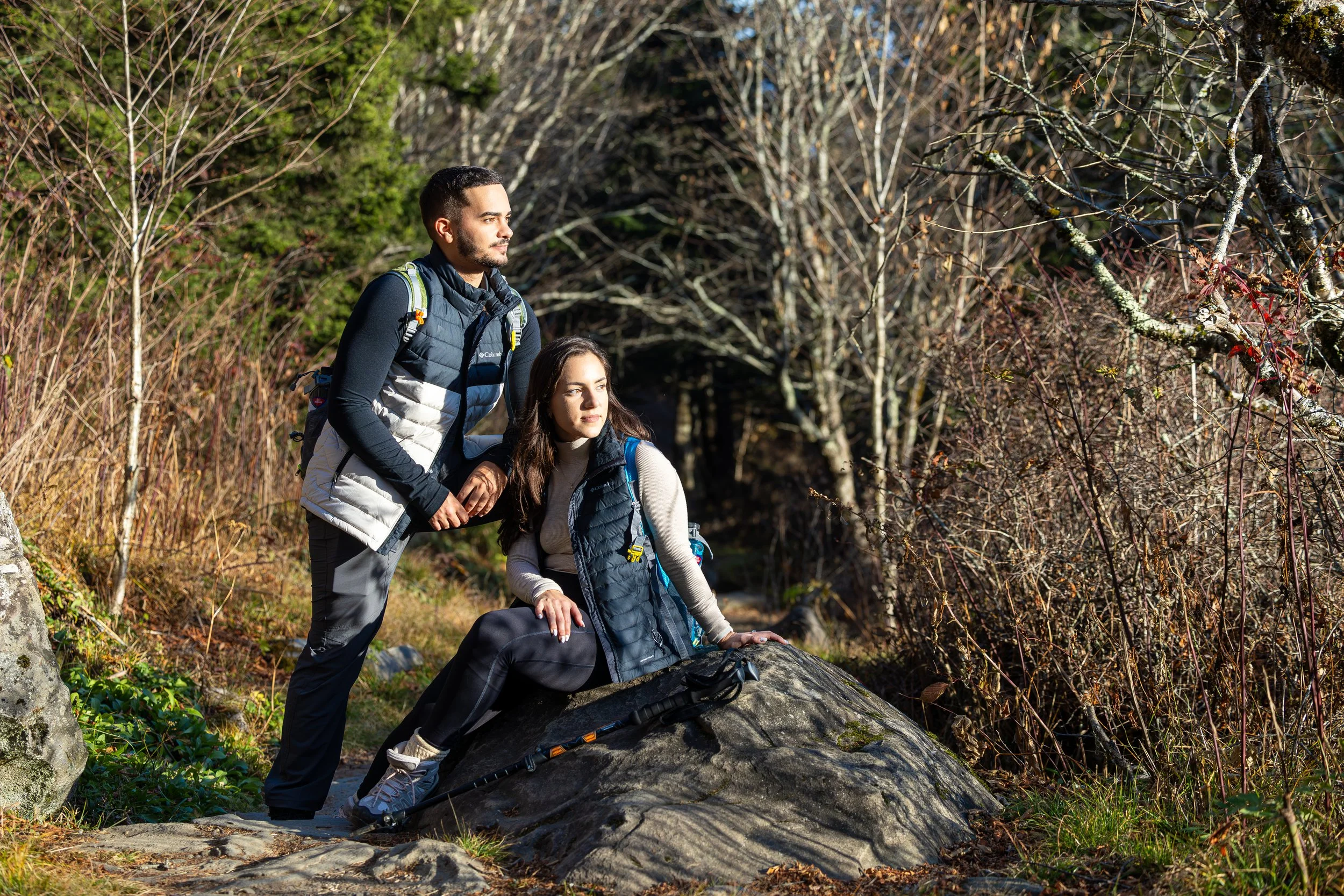 An athletic couple pauses for a portrait along a mountain trail in the Smokies