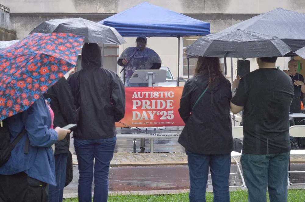  The crowd listens as Timotheus "T.J." Gordon, Jr. speaks onstage. 